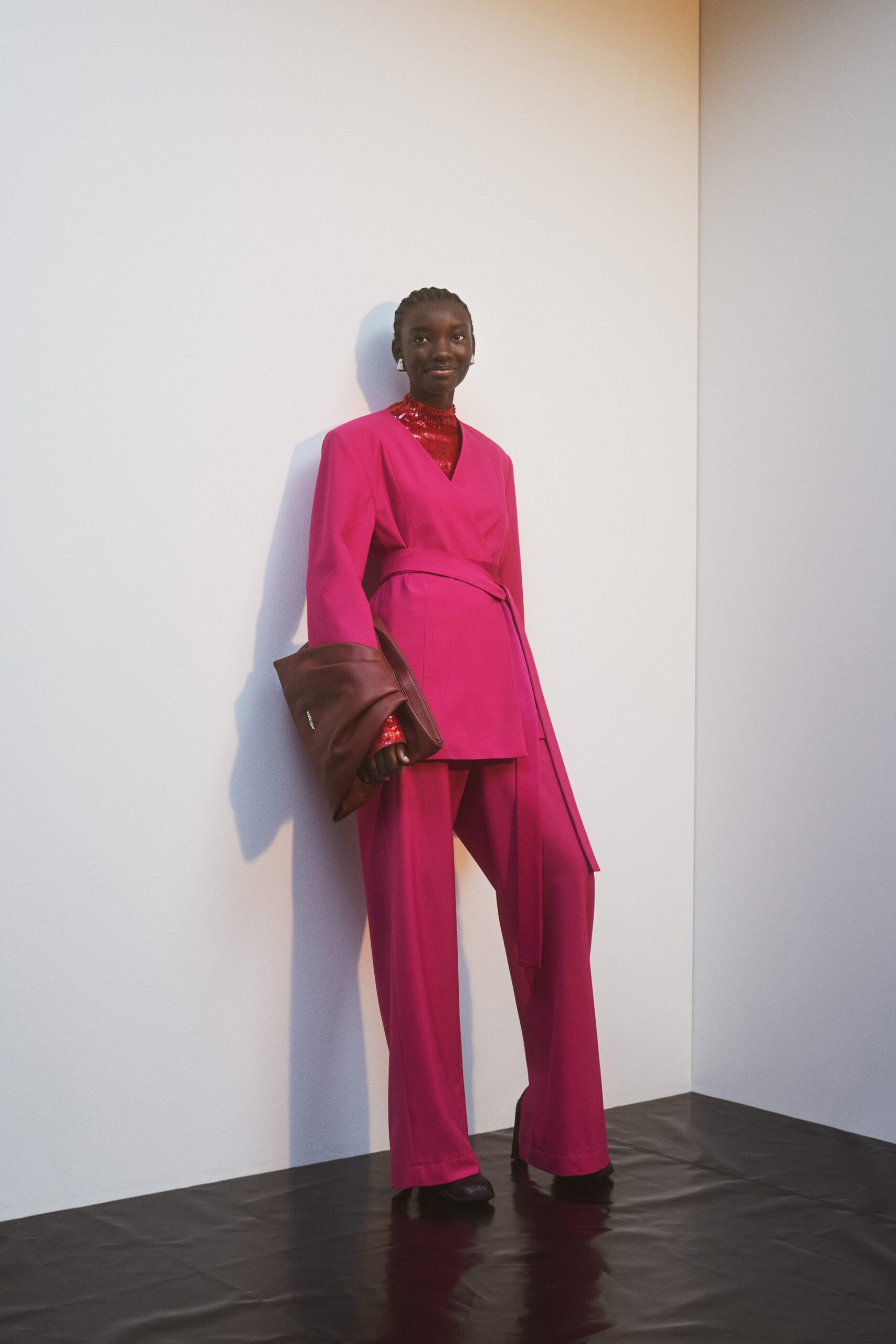 pink silk long-sleeve collared fitted belted suit