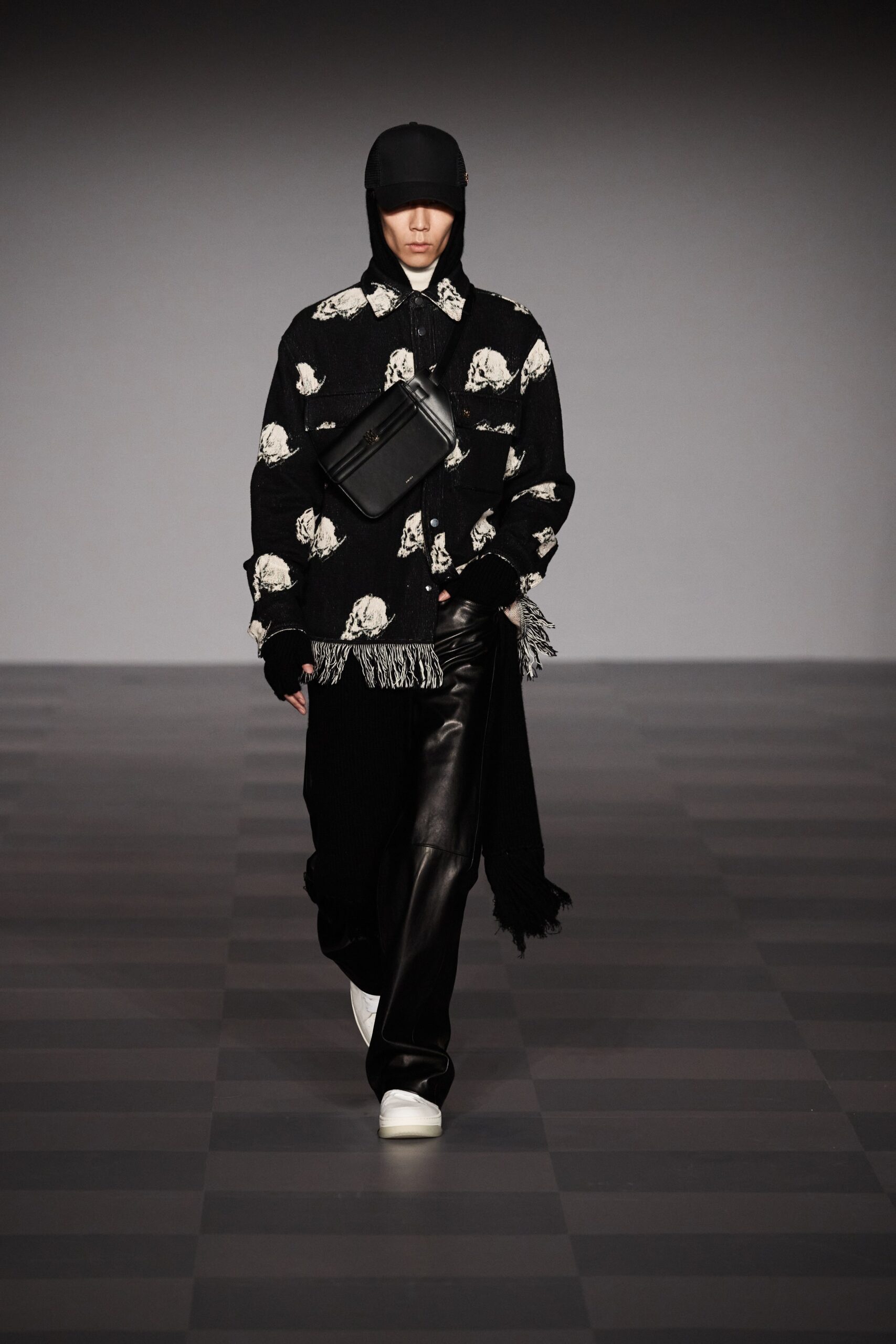 black and white printed shirt with leather pants