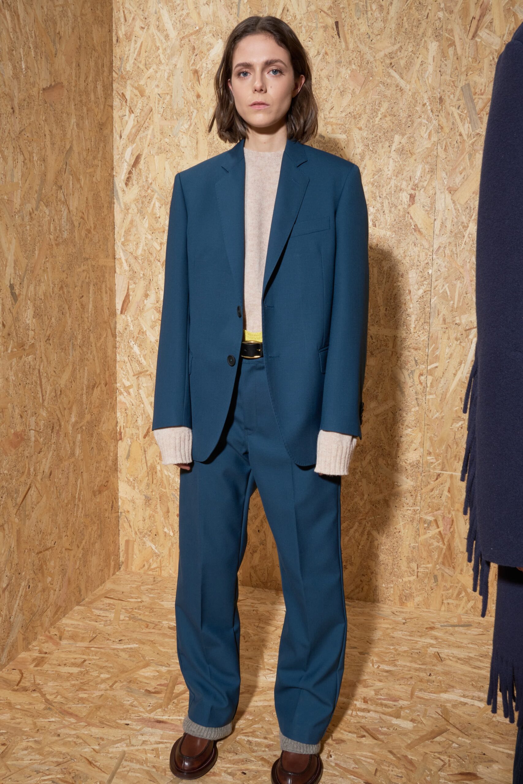 blue tailored suit with beige top
