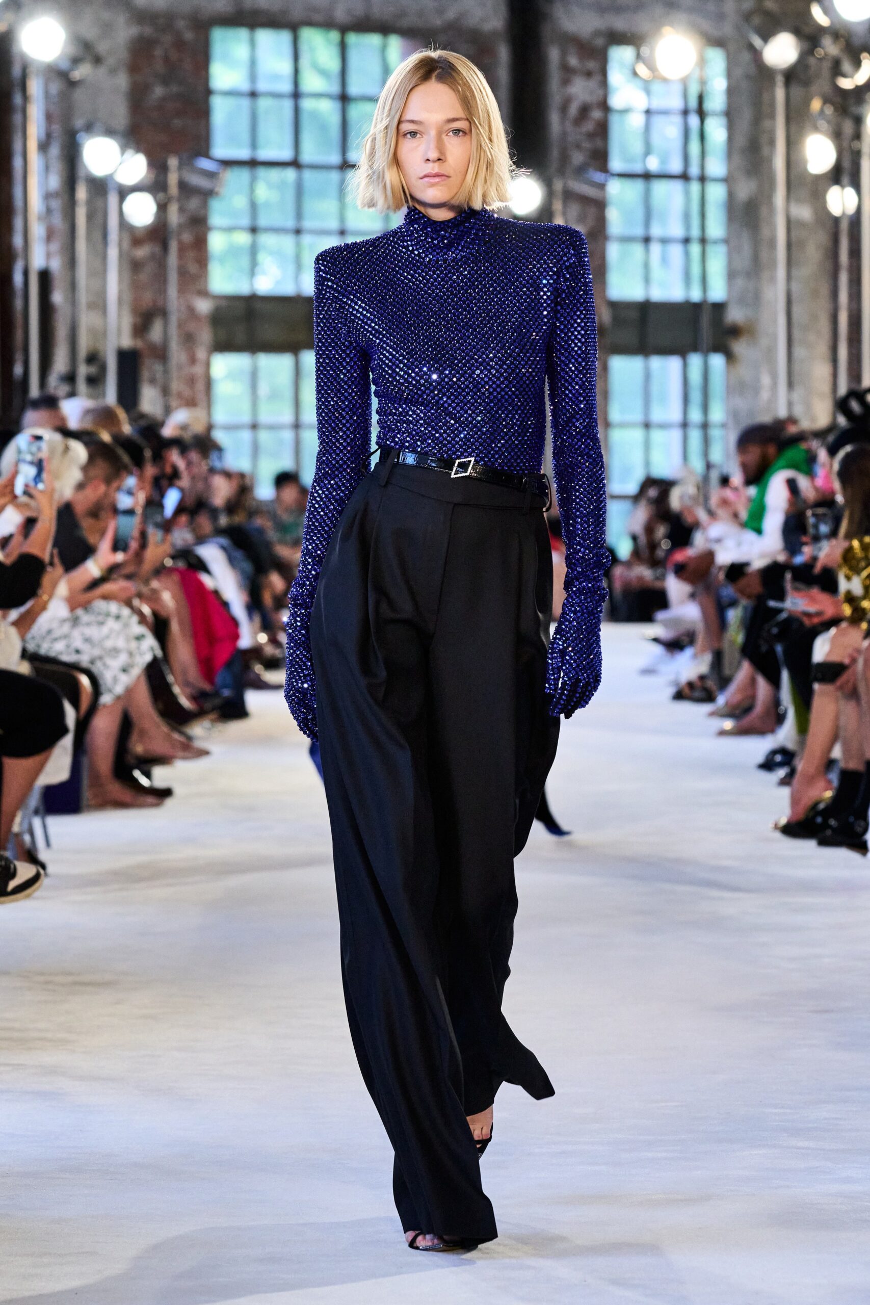 blue sequined fitted top with black pants