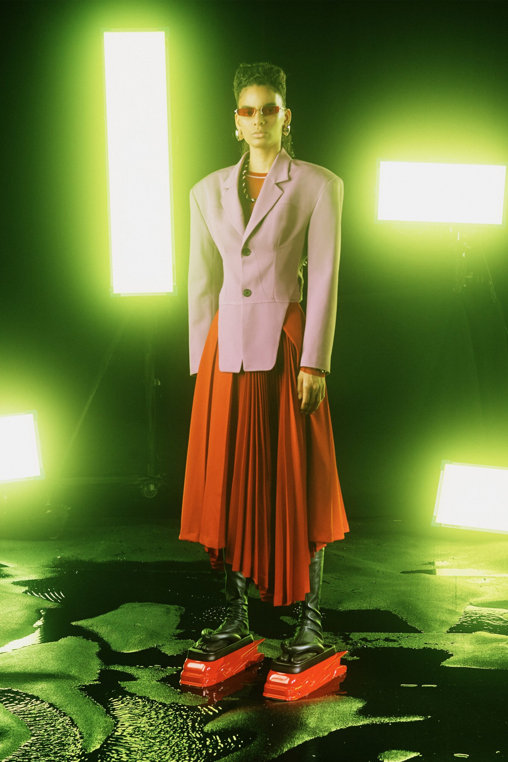purple blazer and red pleated skirt