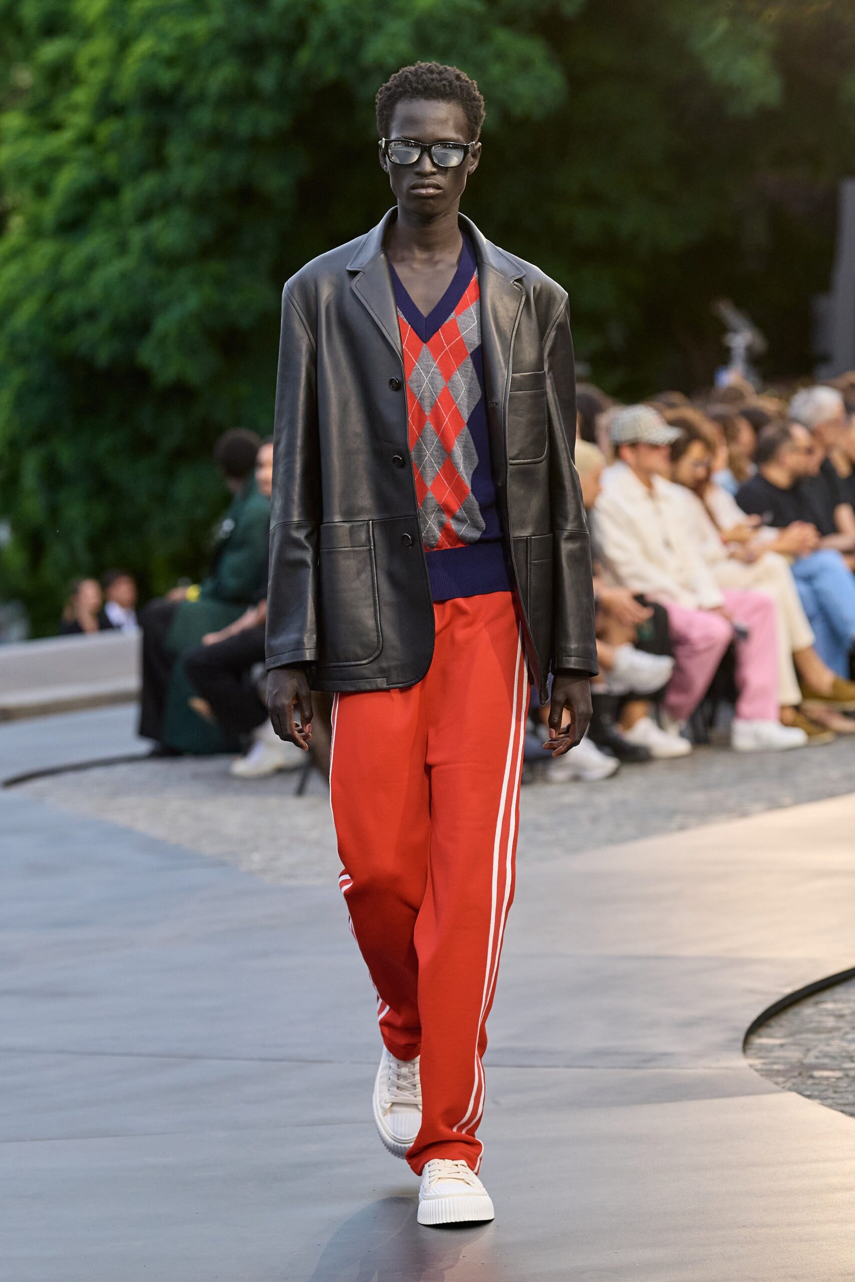 black leather jacket with red pants