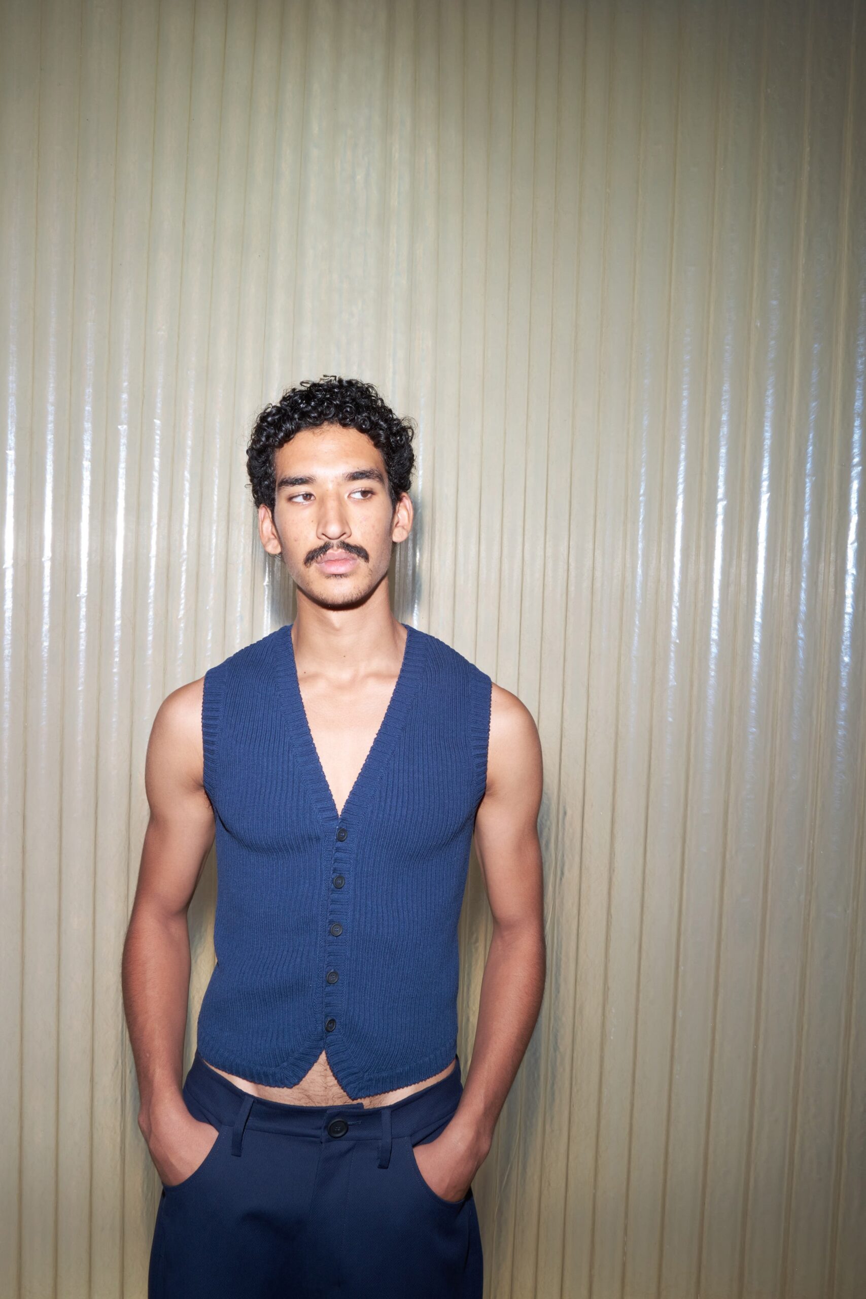 blue fitted vest with tailored pants