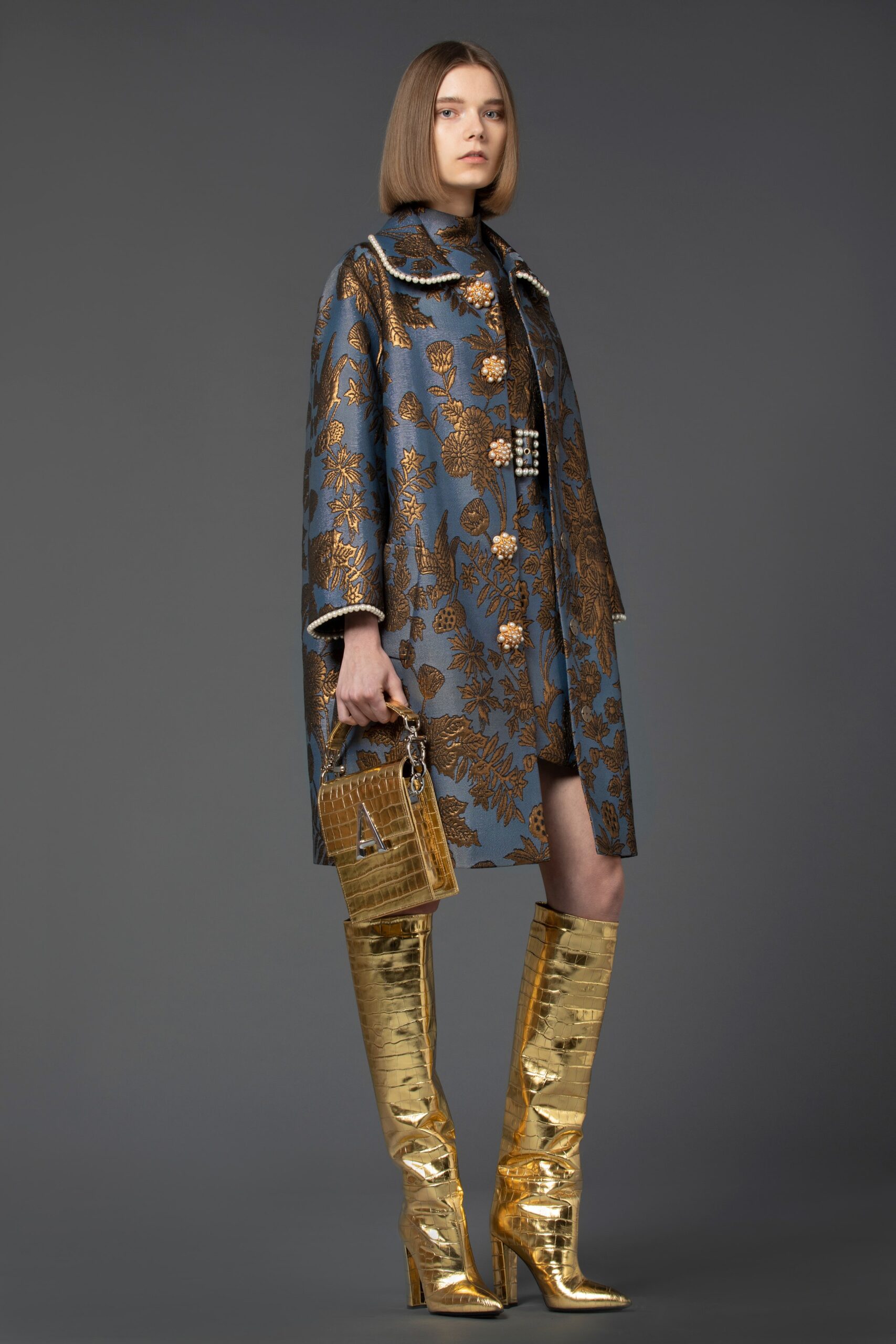 blue embroidered coat with gold boots