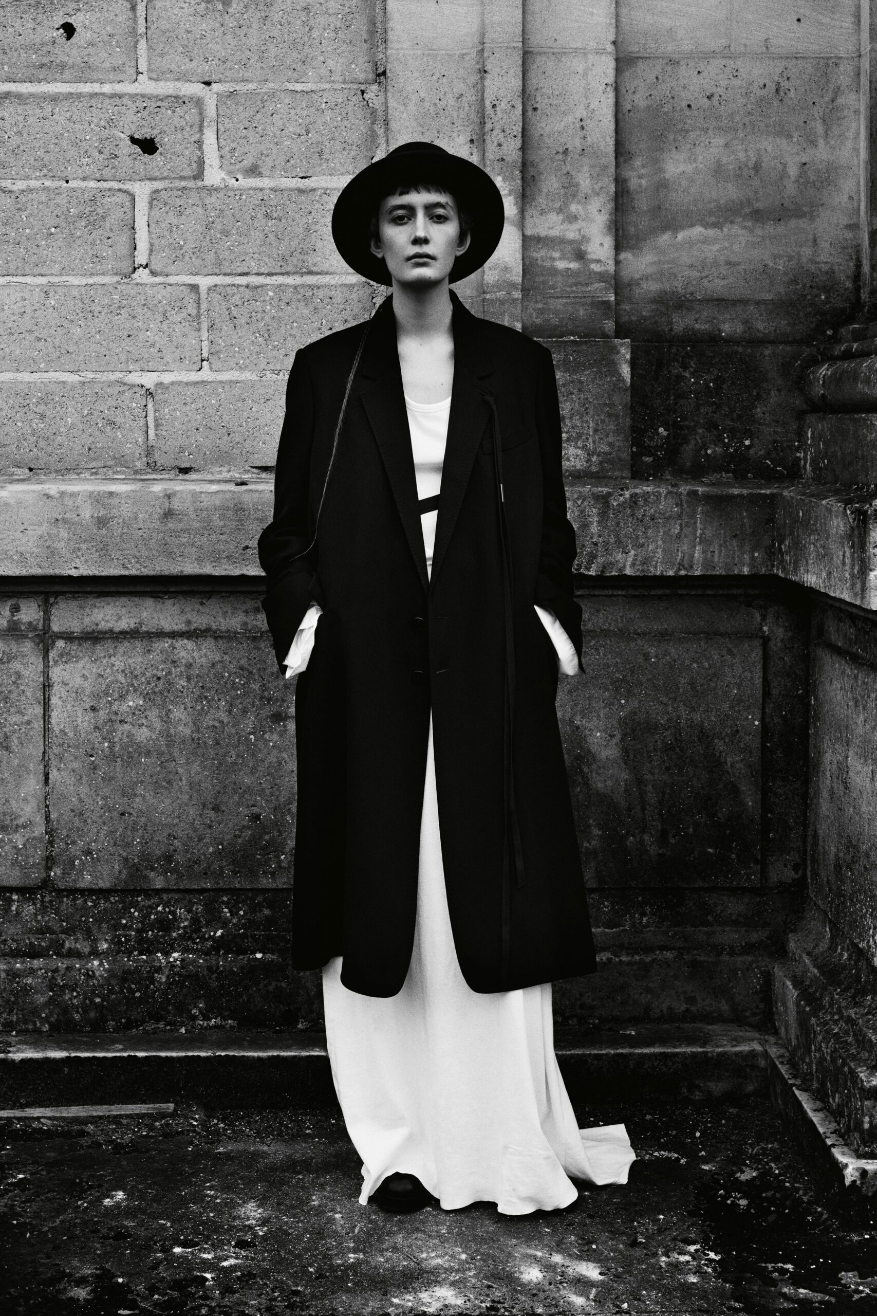black oversized coat and white maxi dress