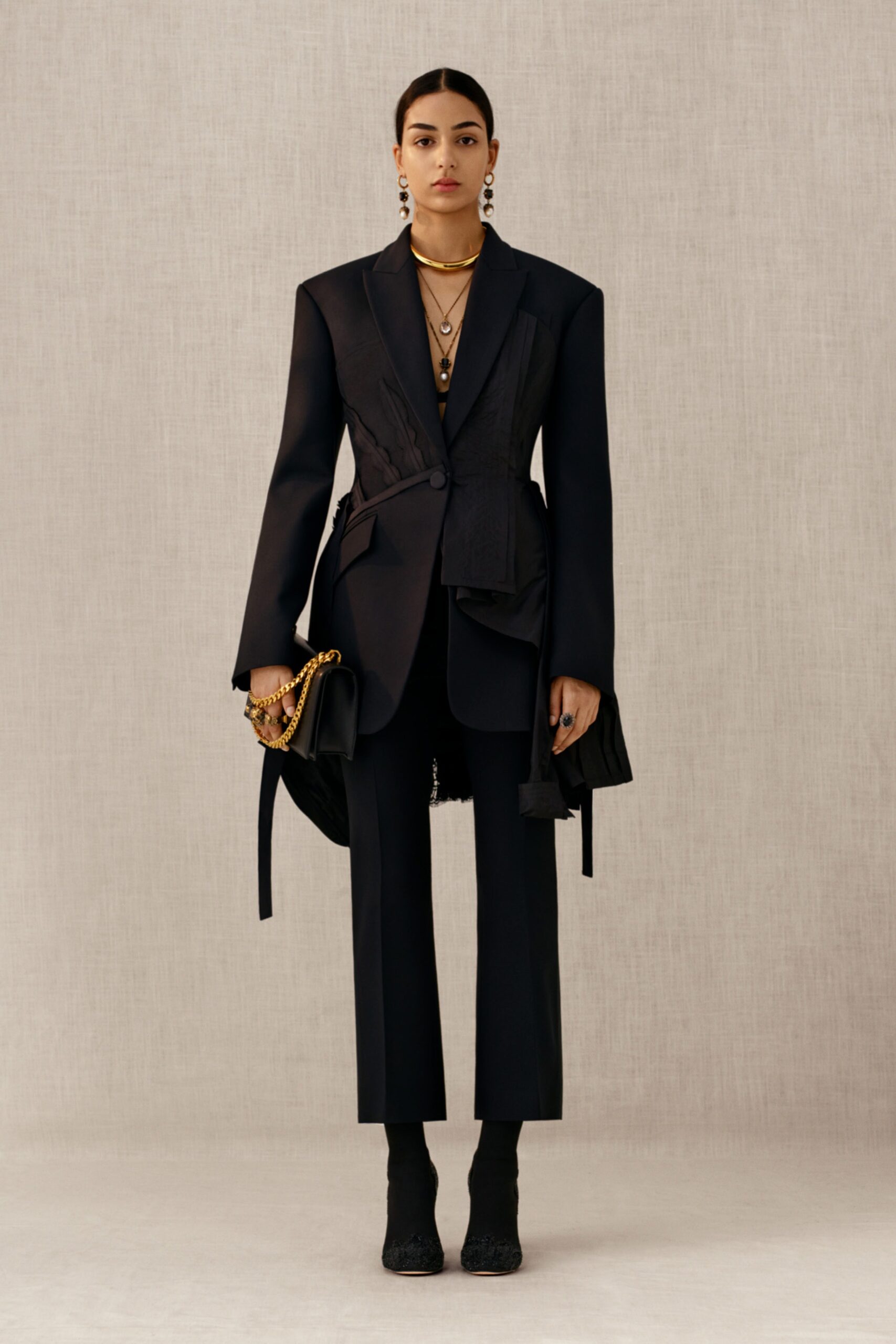 black tailored blazer with slim pants