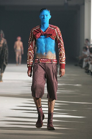 red embroidered top with brown shorts