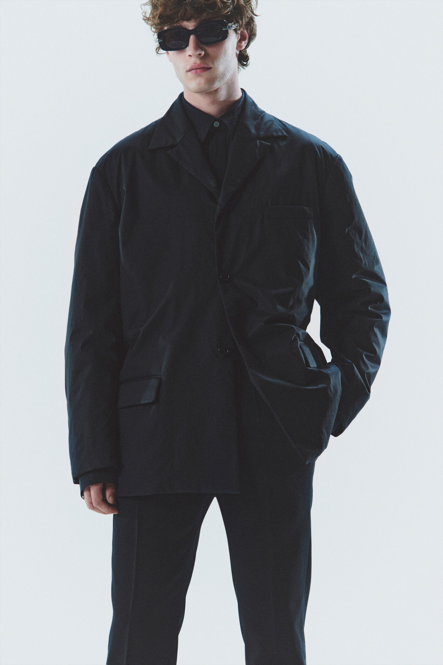 oversized black jacket and tailored pants