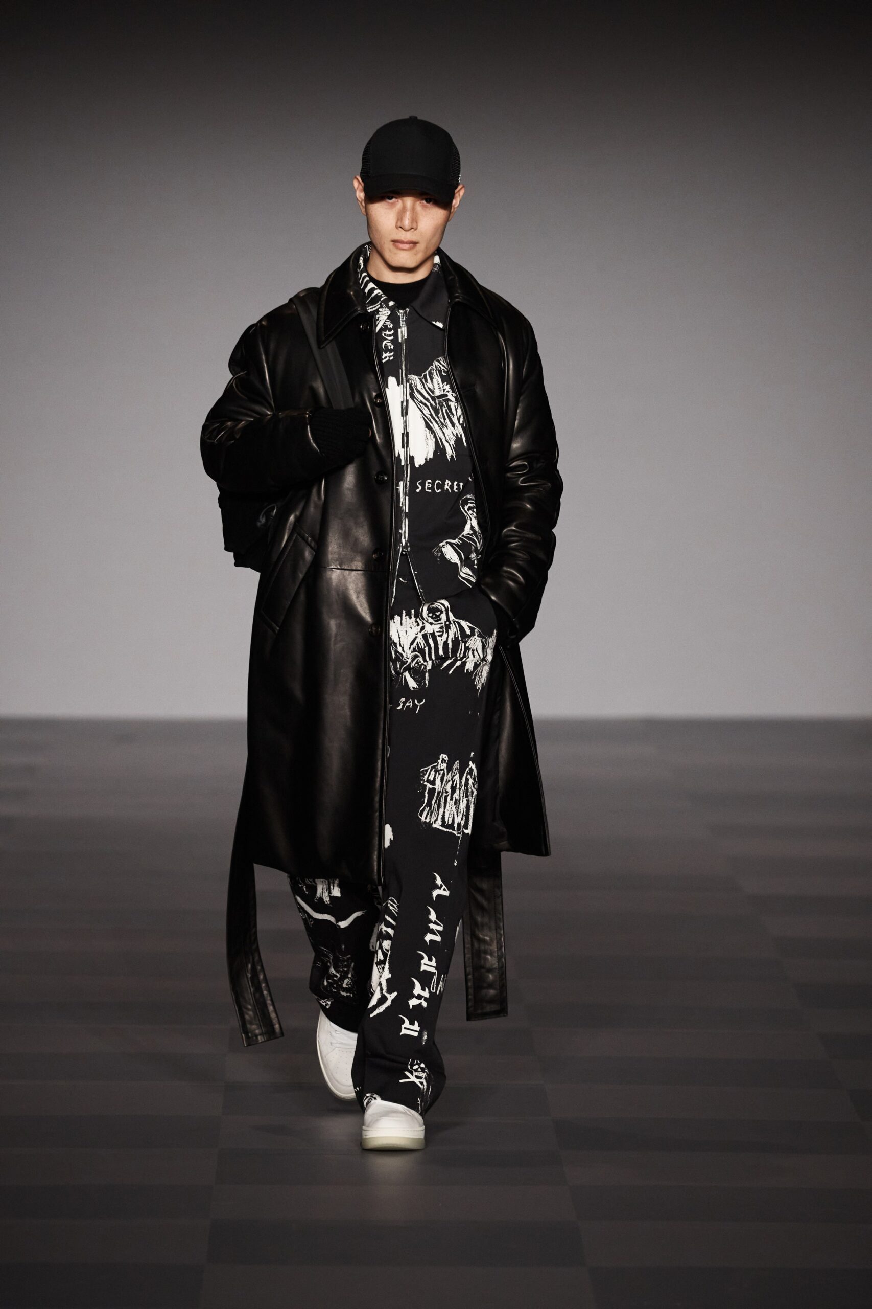black leather coat with printed pants