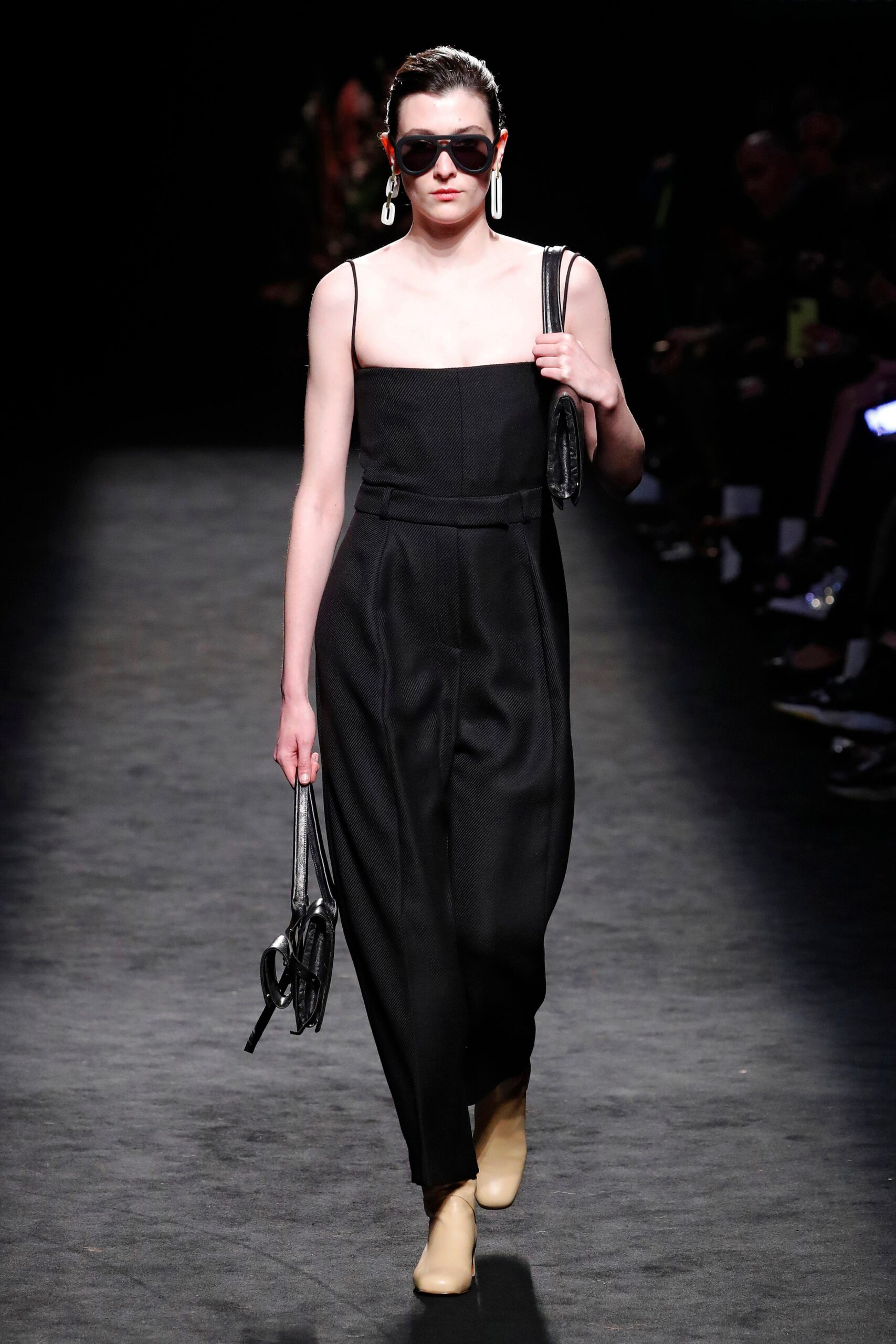 black fitted jumpsuit with accessories