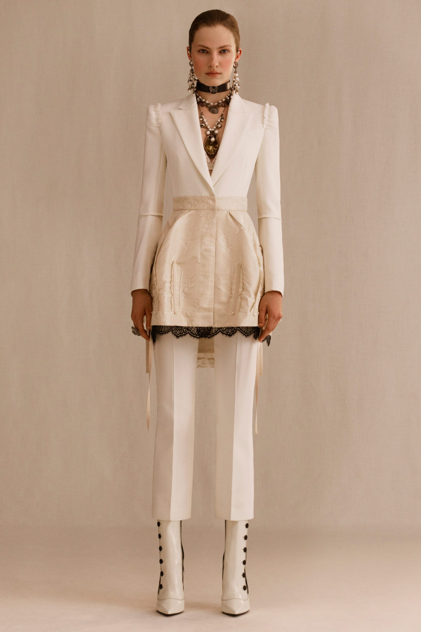 white tailored suit with boots