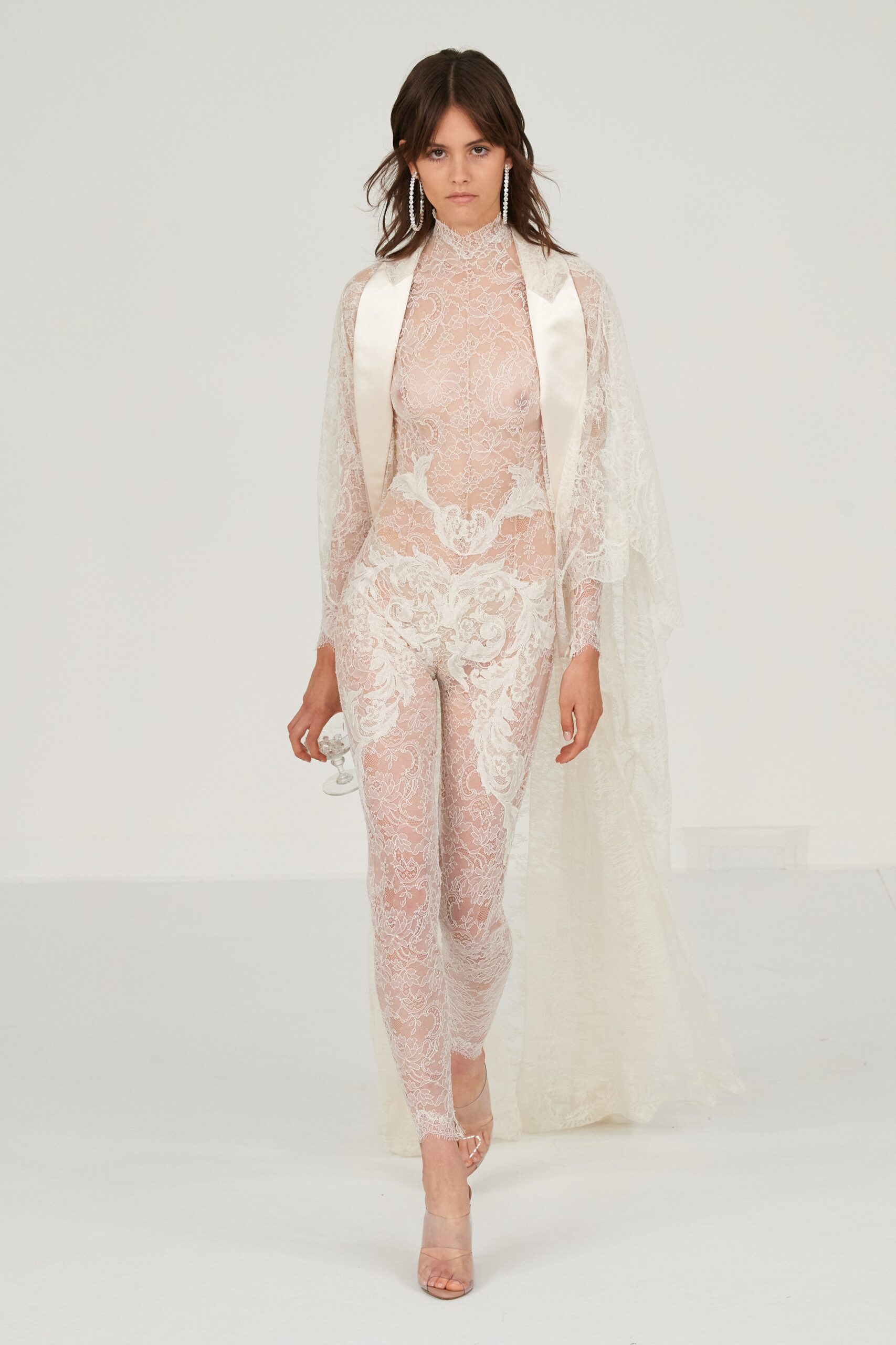 white lace catsuit with cape