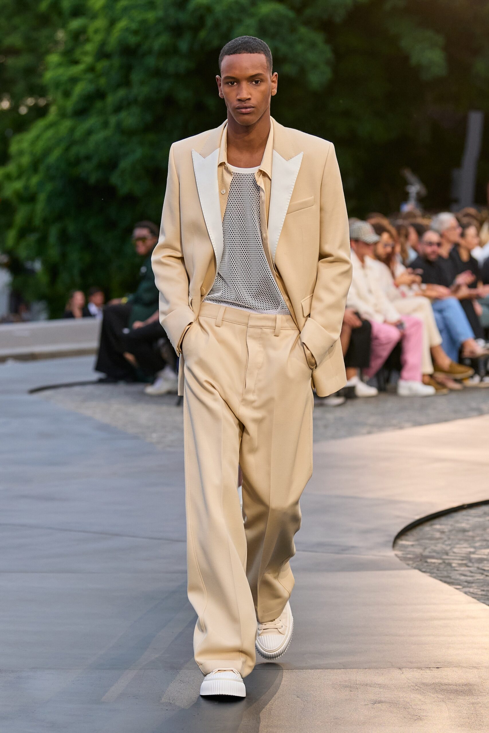 beige tailored suit with white t-shirt