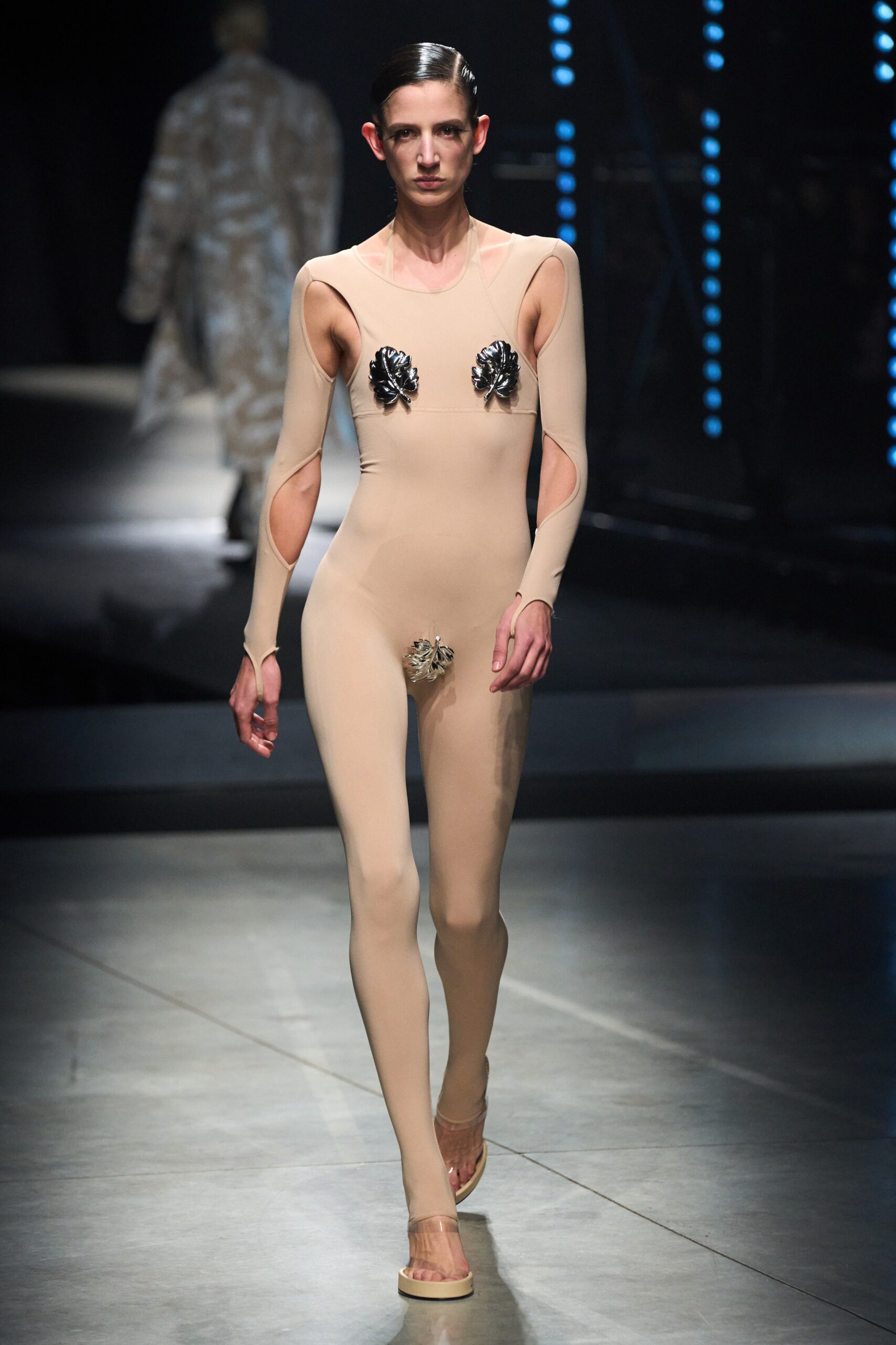 beige fitted sleeveless catsuit