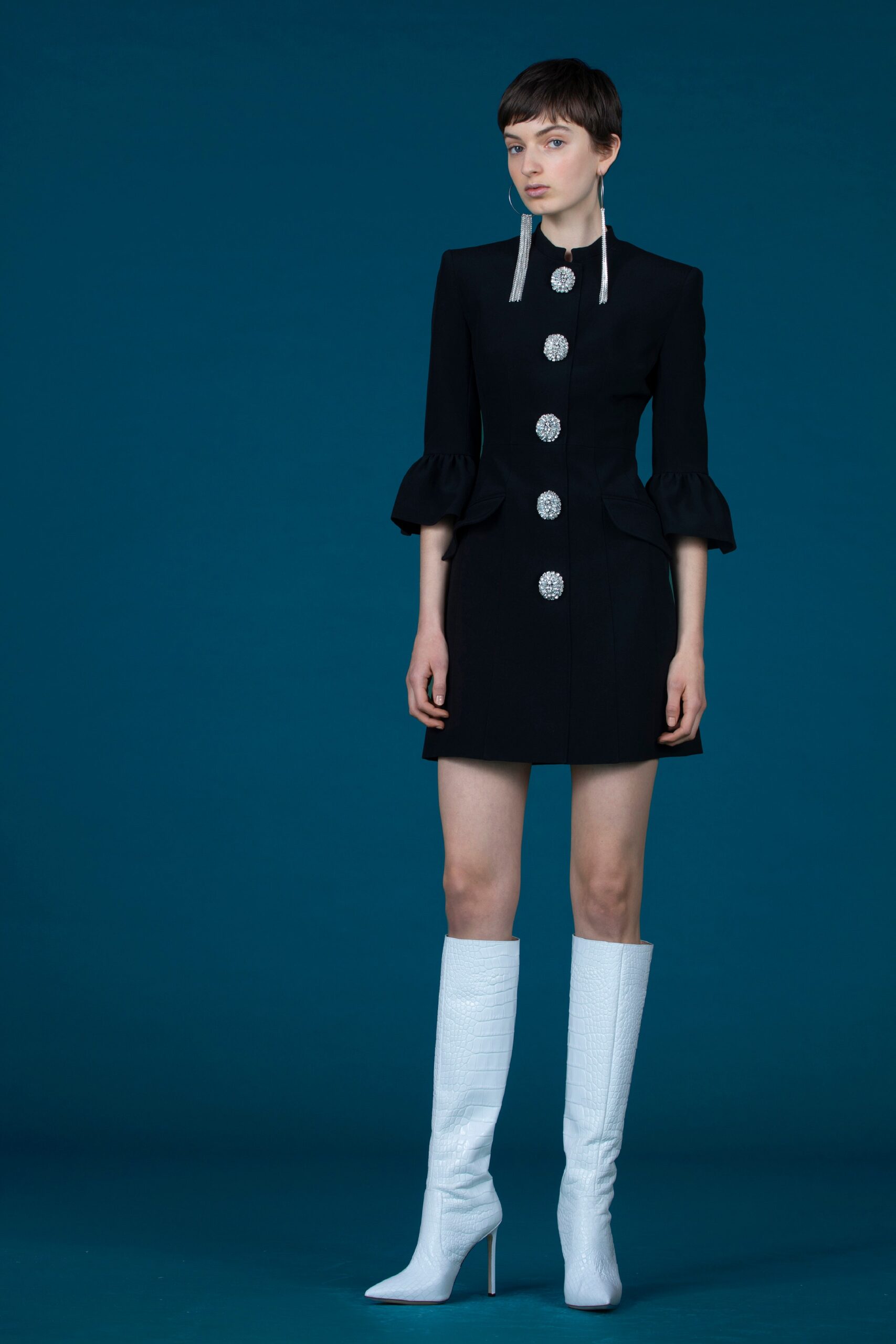 black fitted mini dress with white boots