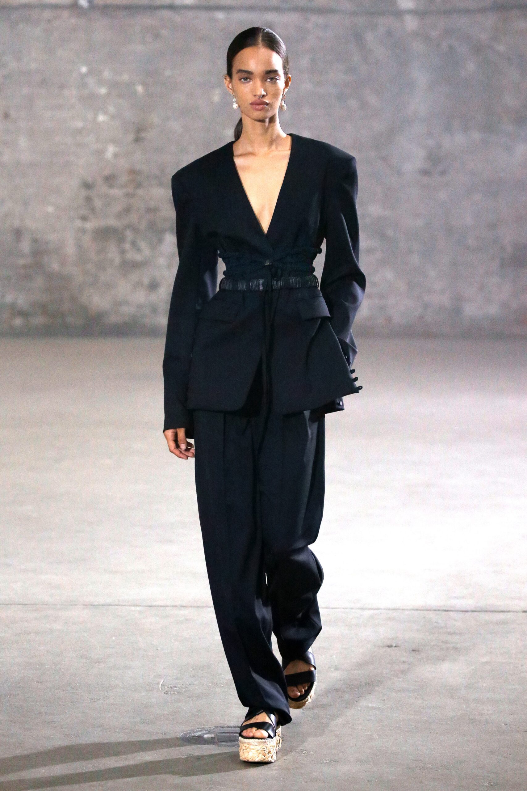 black tailored blazer and relaxed pants