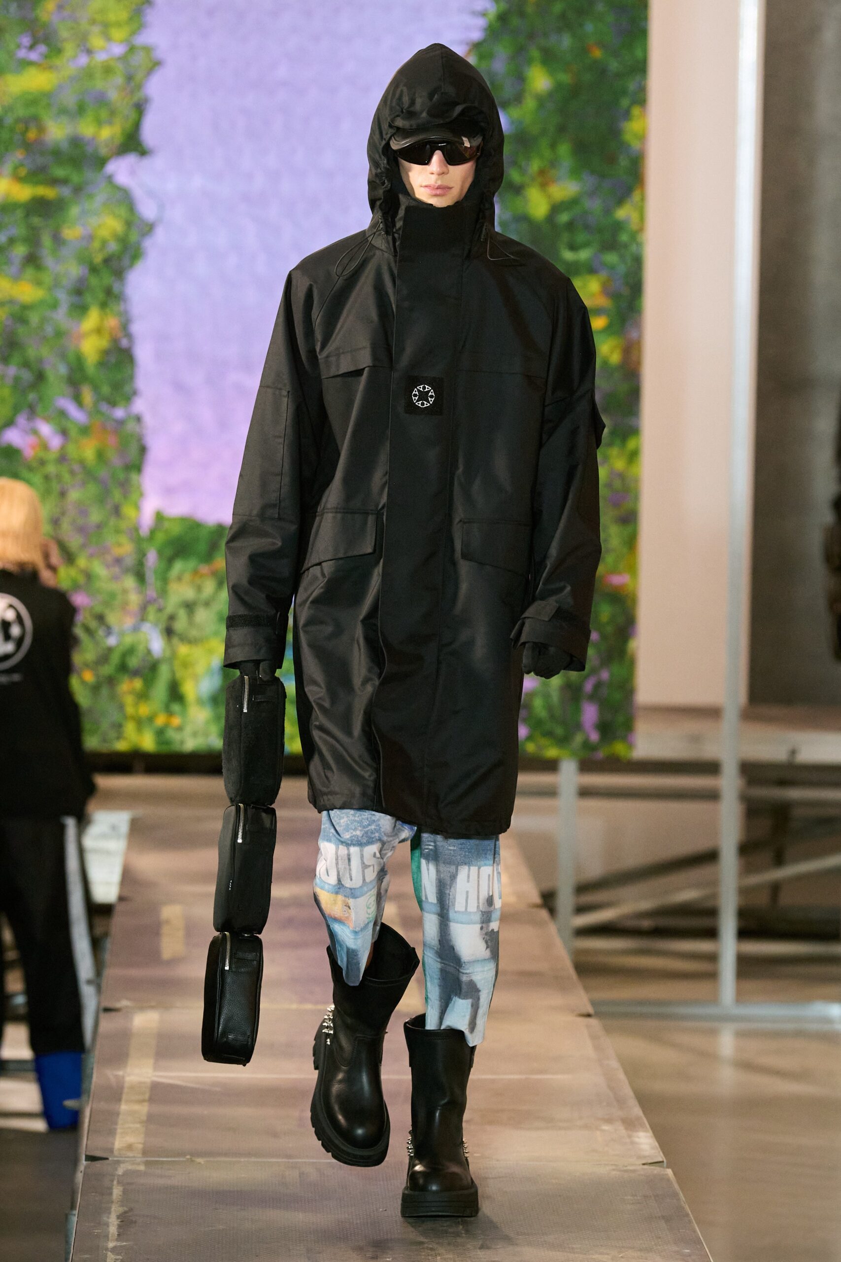black vinyl coat with distressed denim