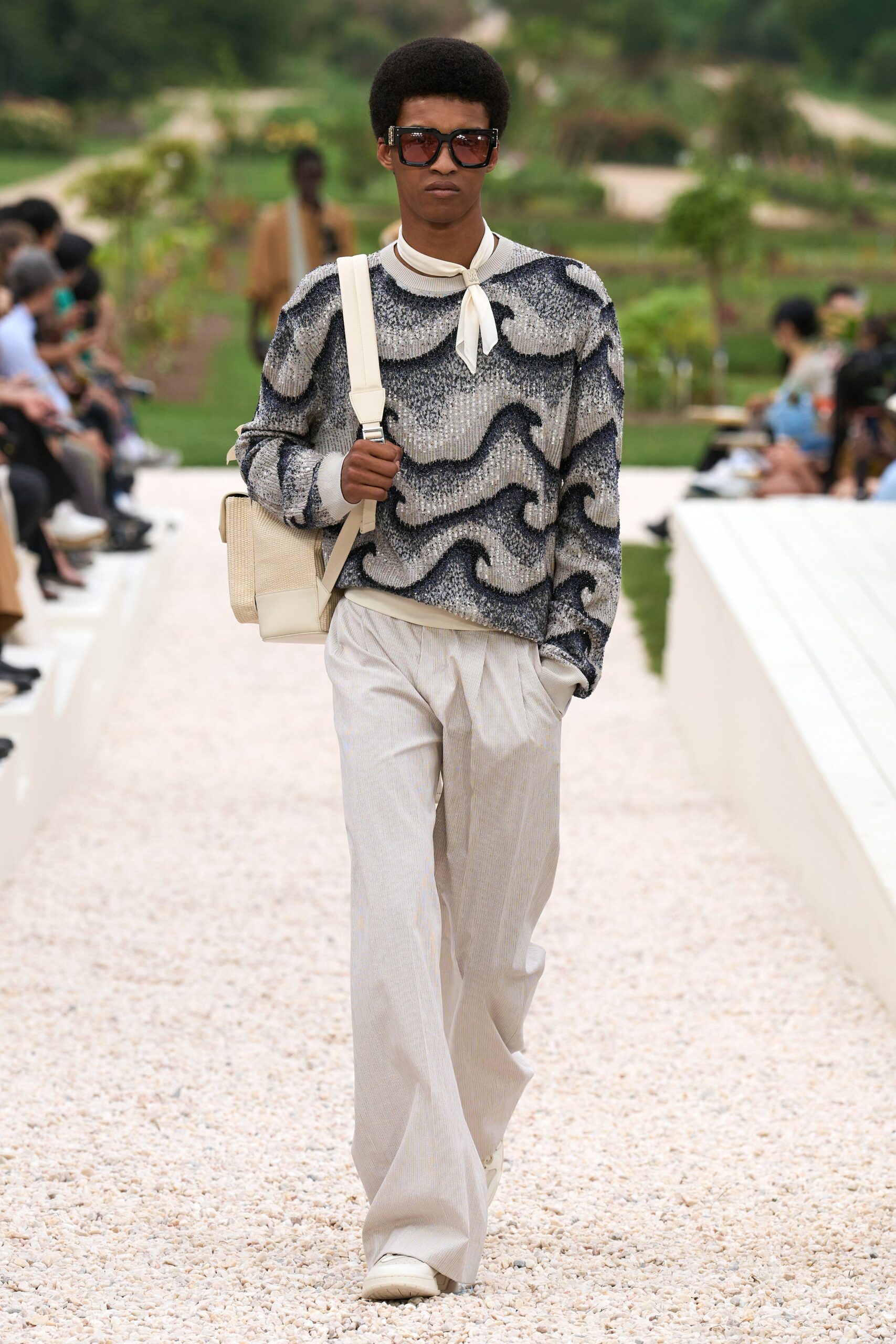blue printed sweater with beige pants