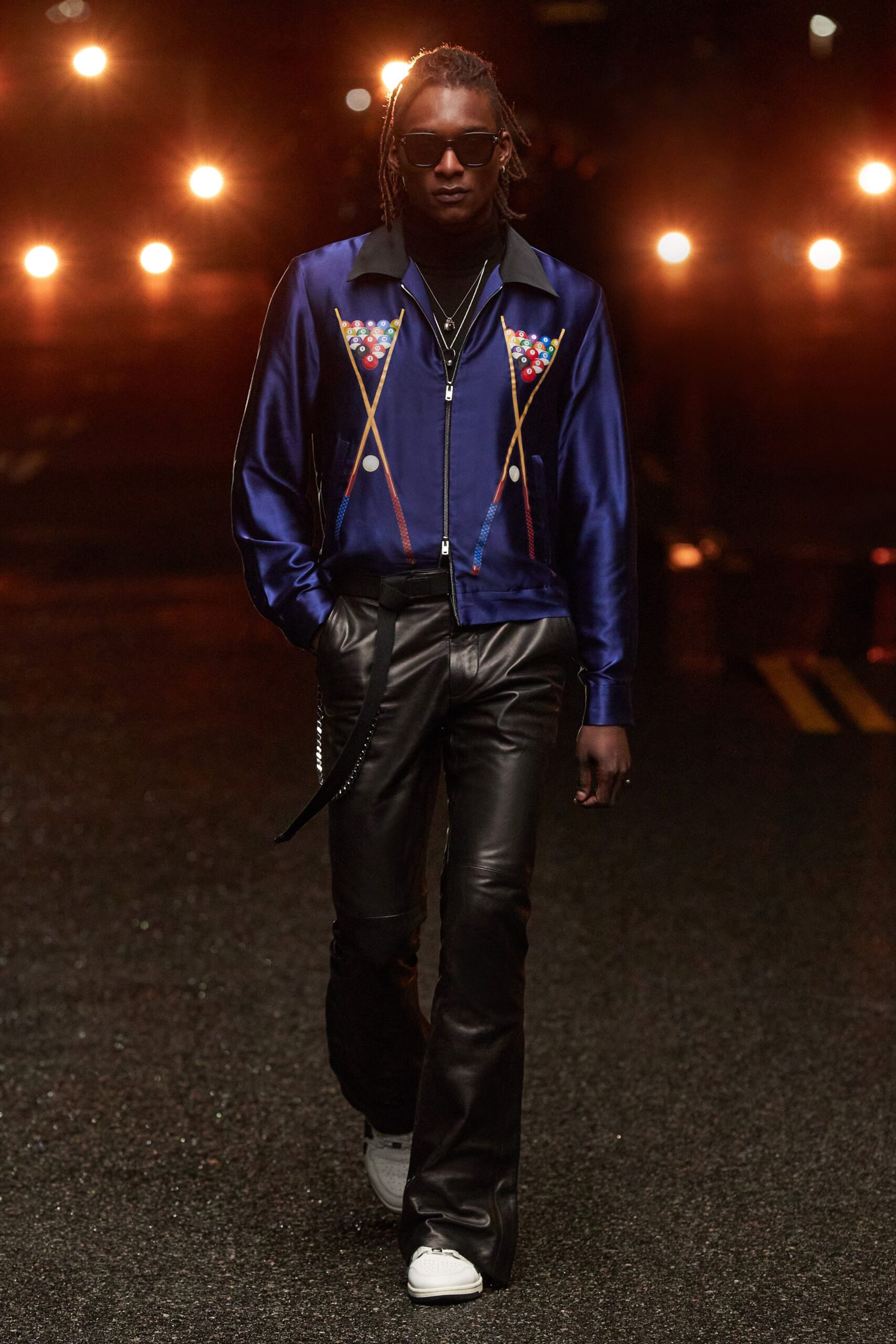 blue silk shirt and black leather pants