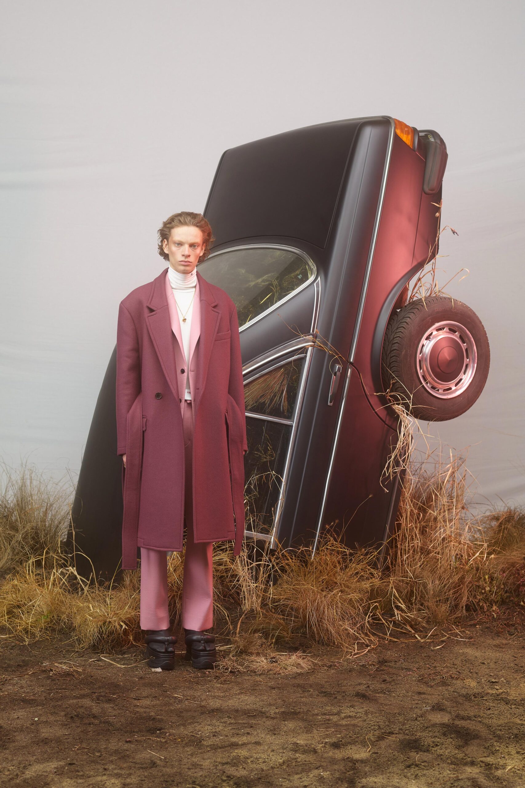 purple wool tailored coat and pink fitted pants