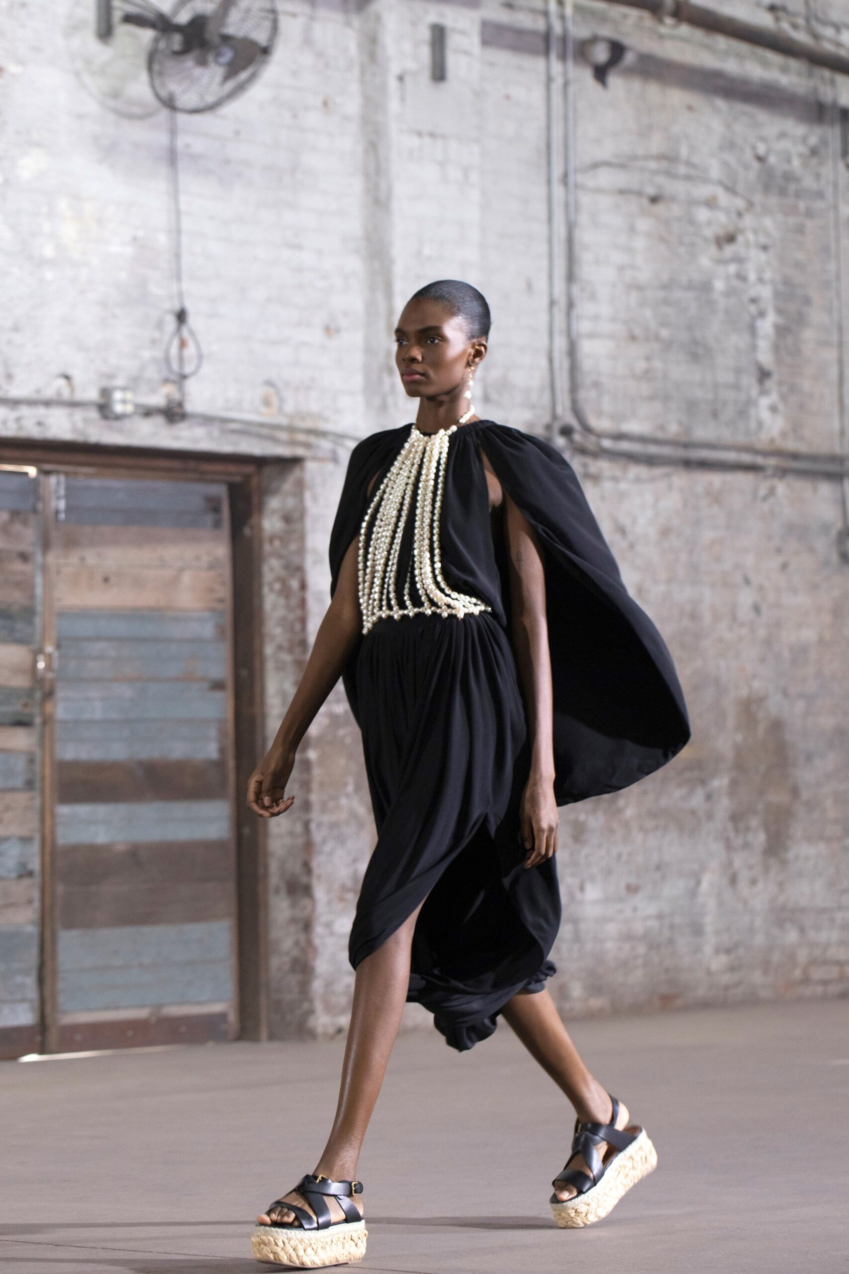 black fitted midi dress with cape