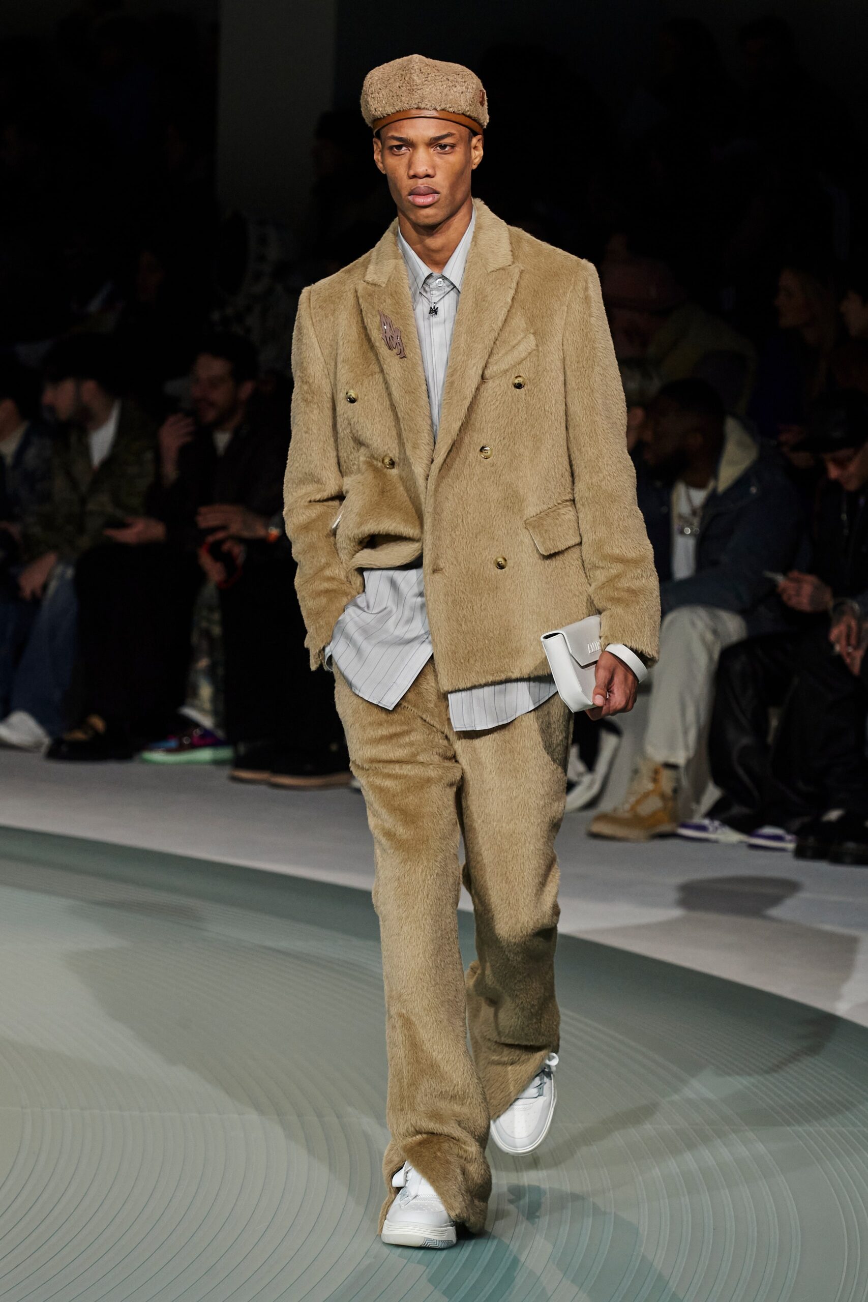 beige tailored suit with gray shirt