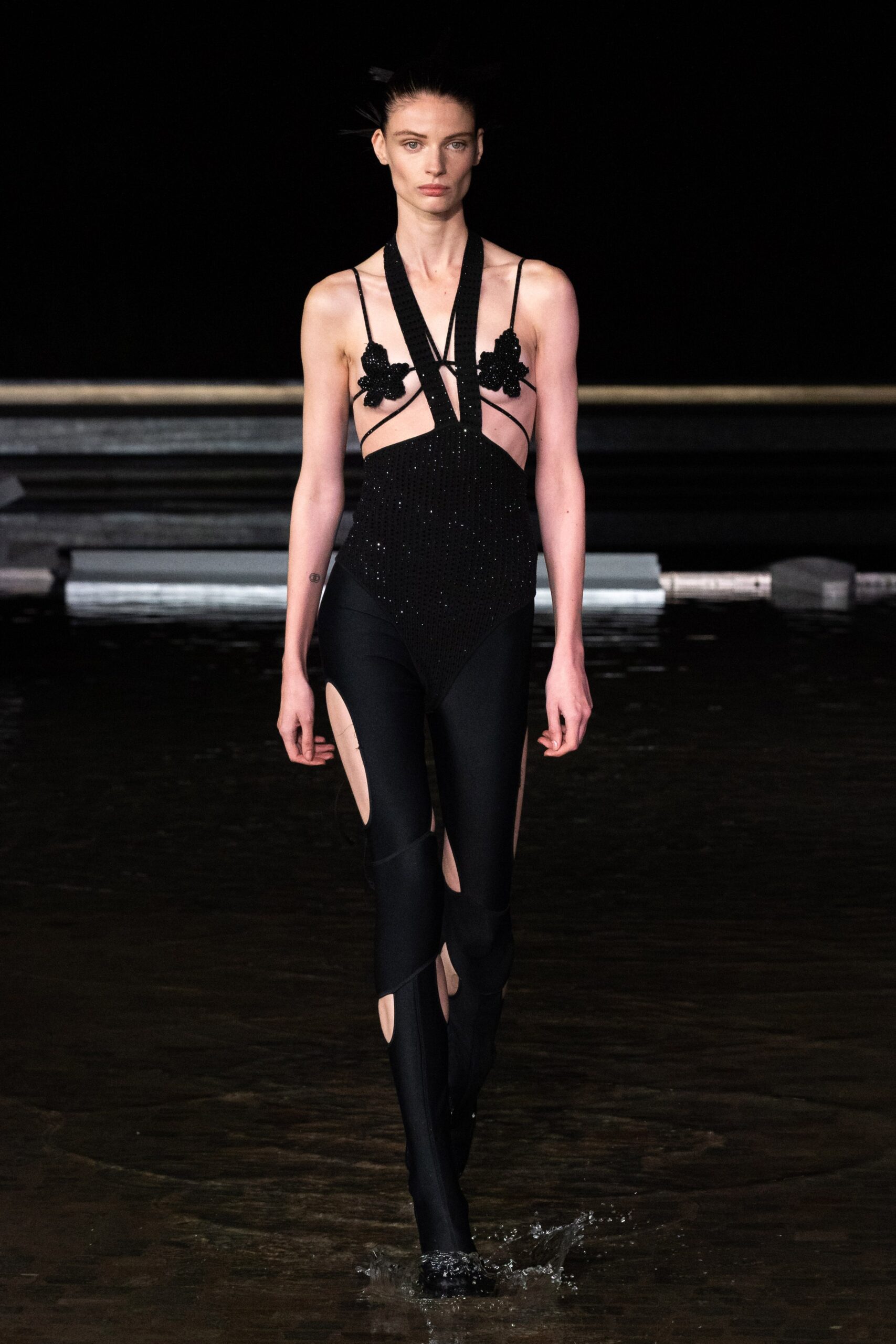 black fitted sleeveless catsuit