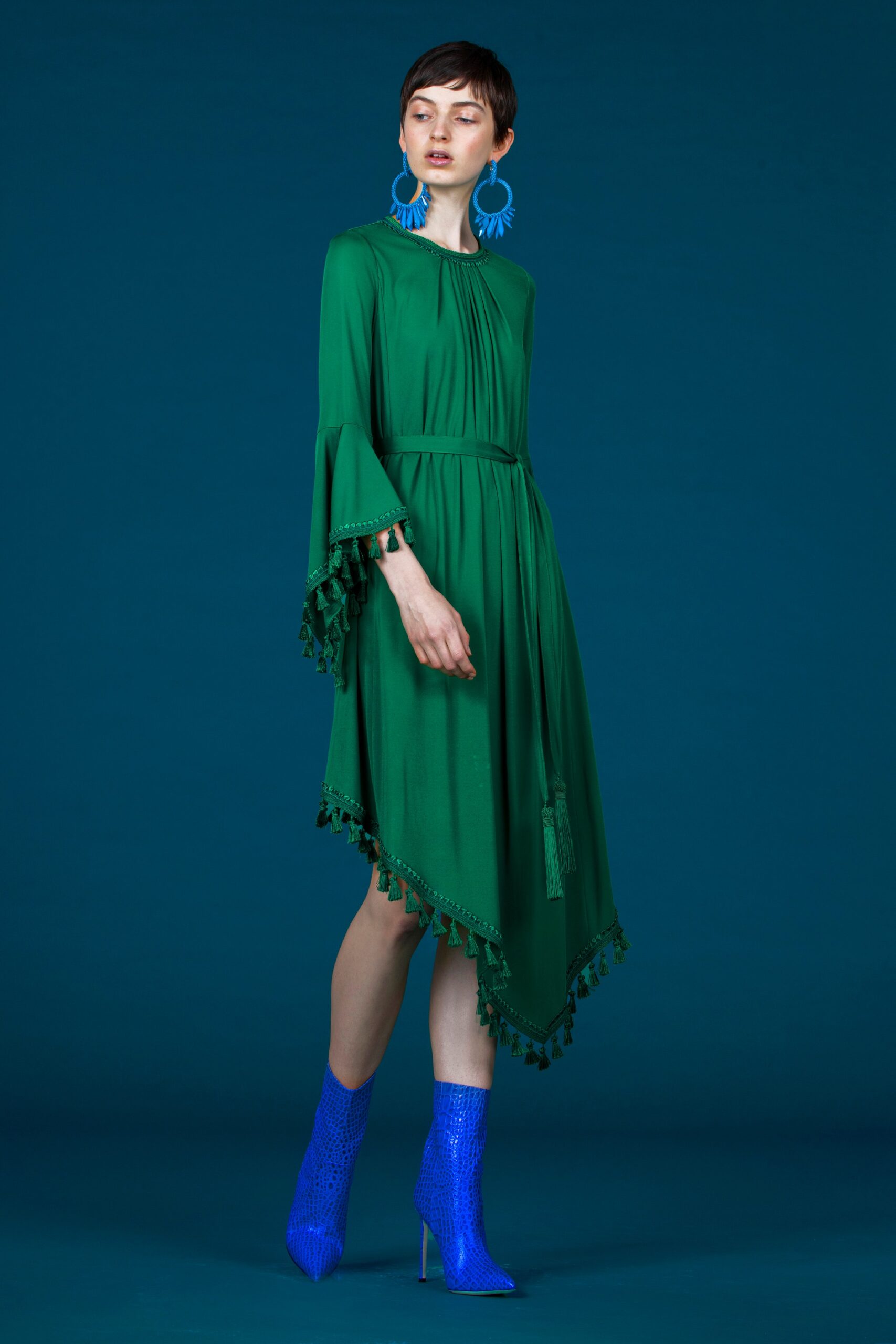green asymmetric dress with blue boots