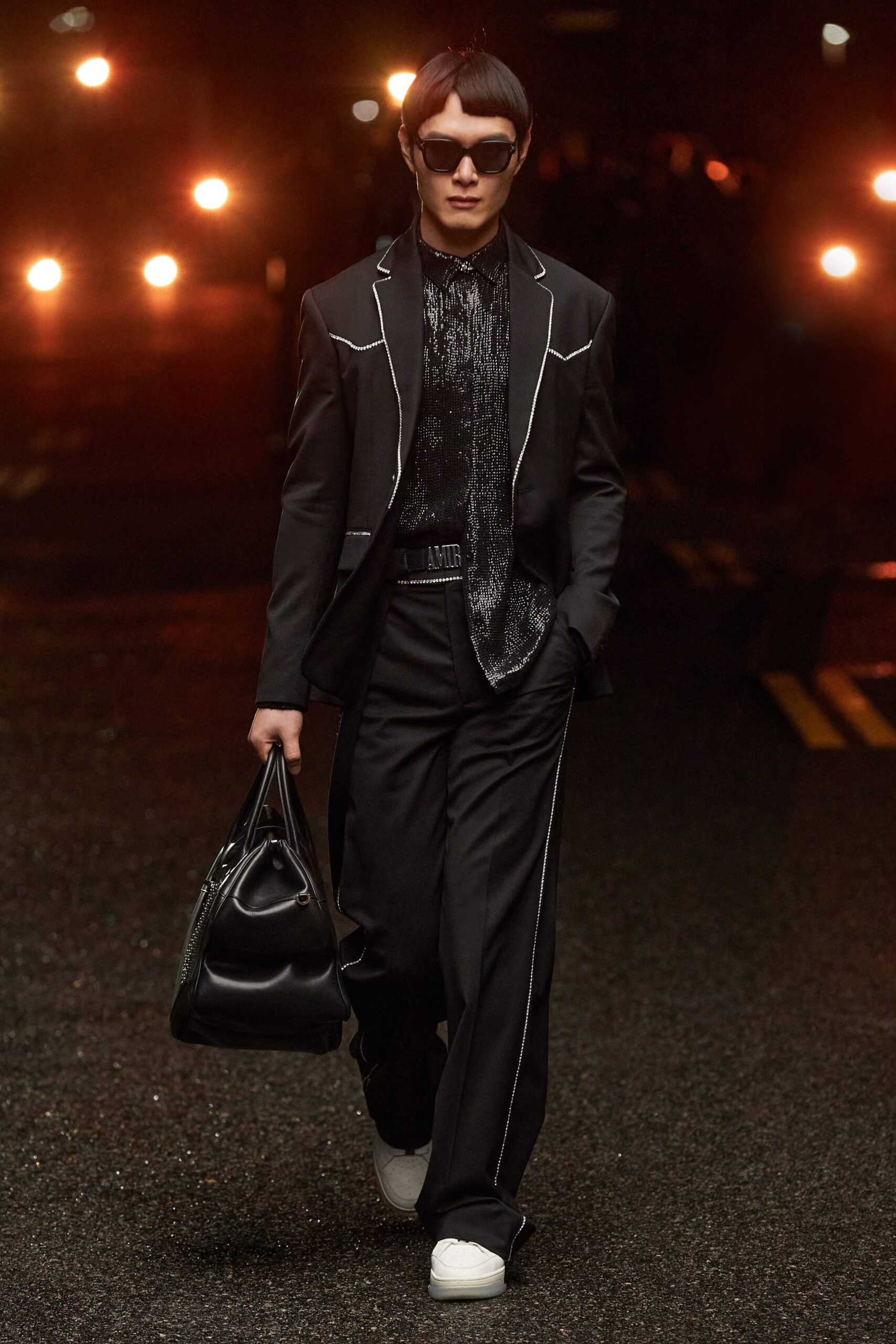 black tailored suit with white shoes