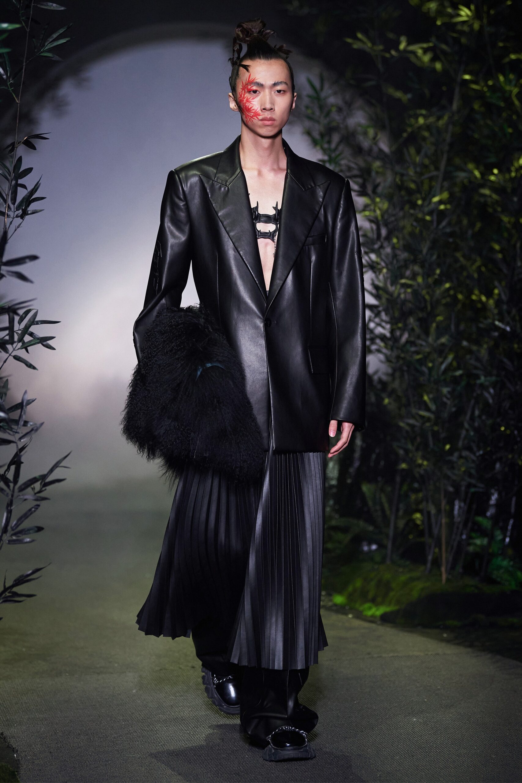 black leather oversized blazer and pleated skirt