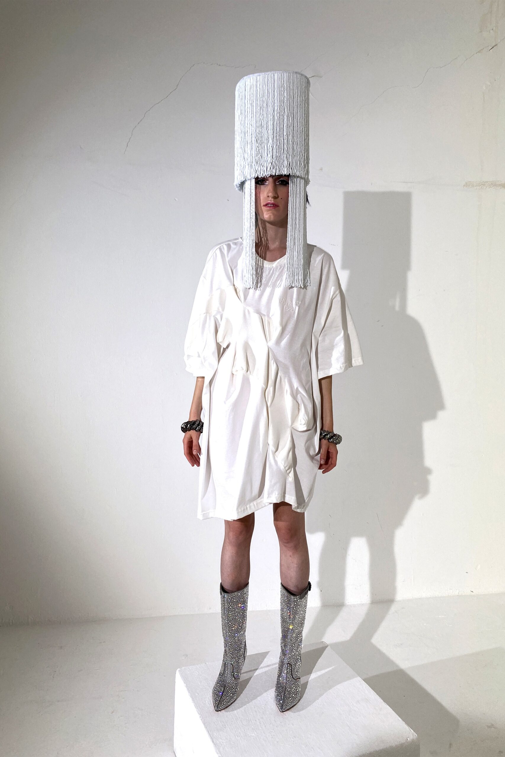 white relaxed dress with silver boots