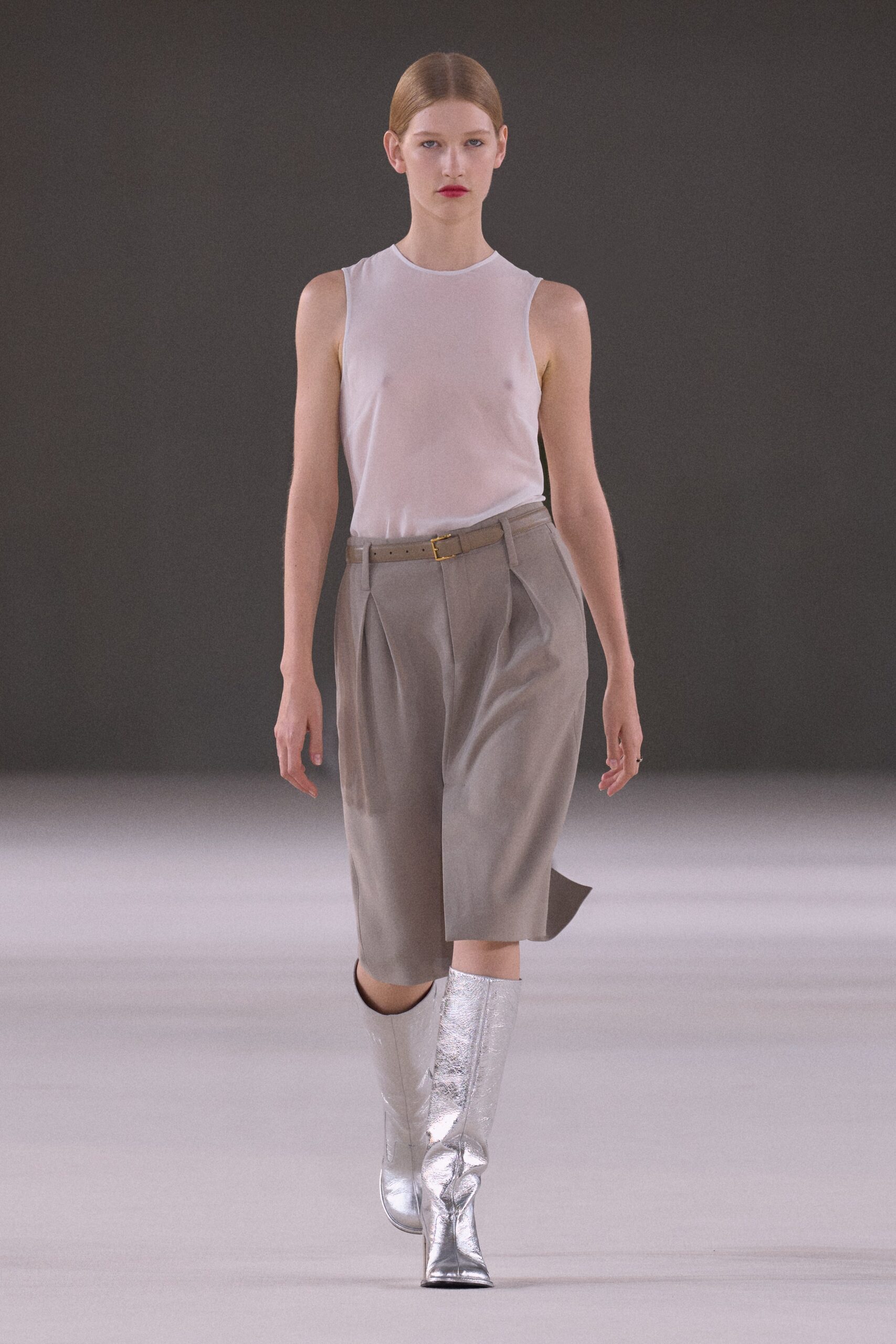 white silk sleeveless top with gray shorts