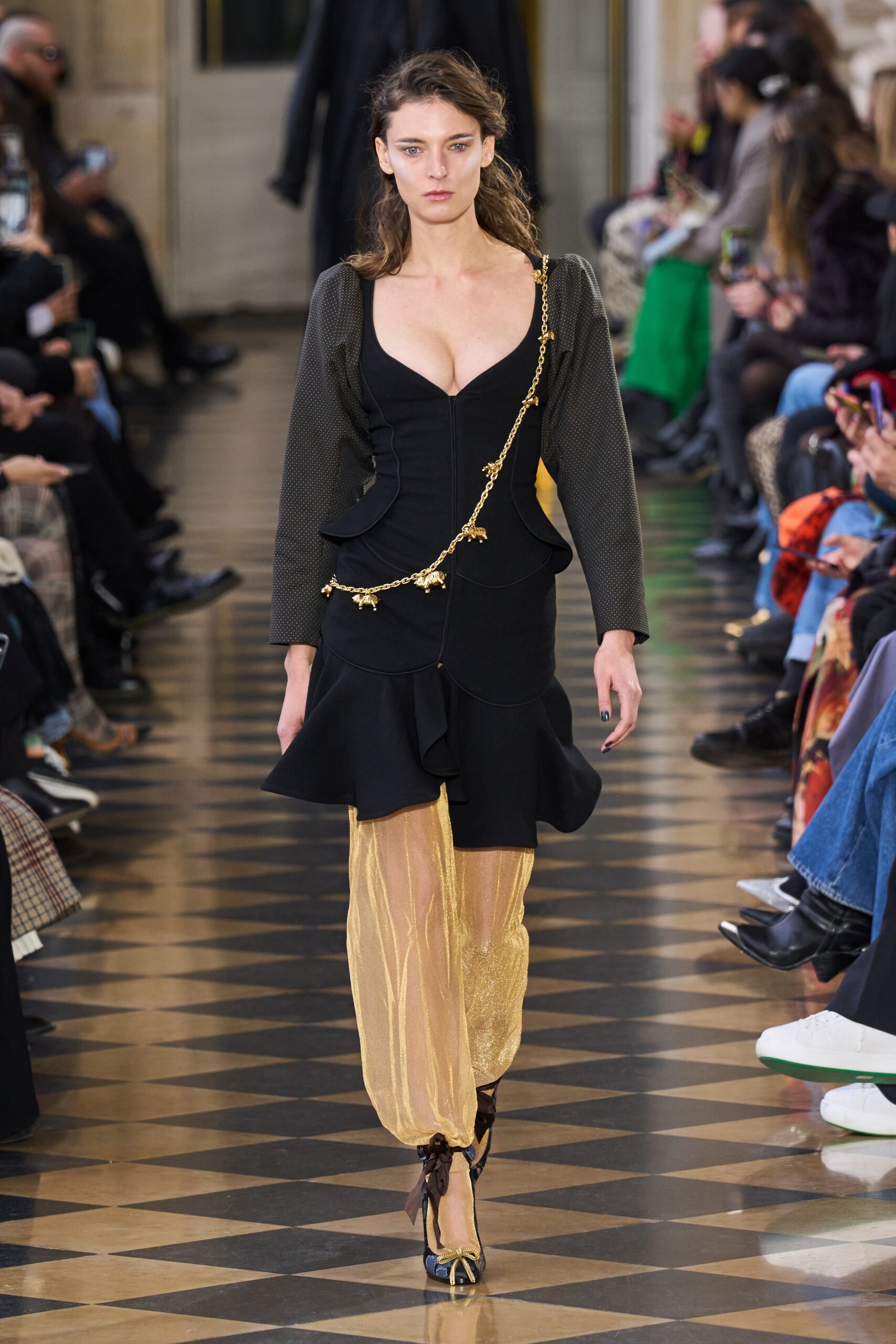 black silk fitted dress with gold pants