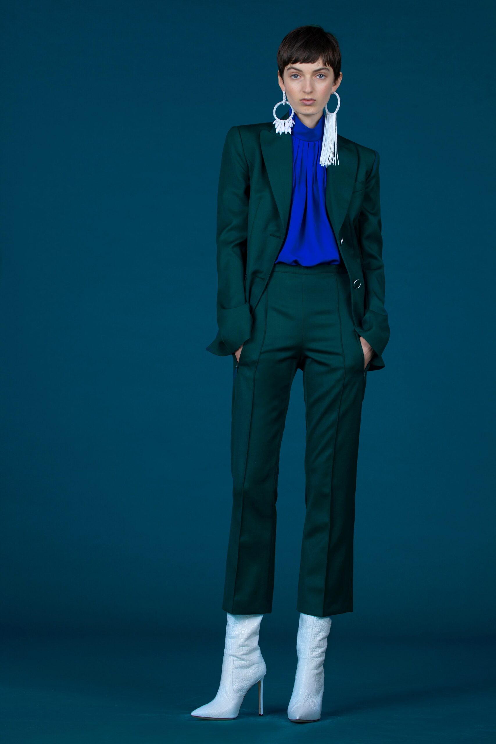 green tailored suit with blue blouse