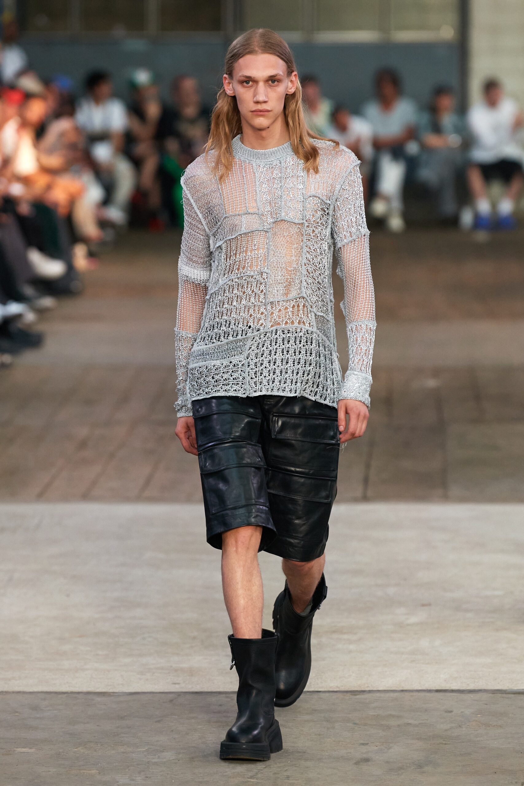 white mesh long-sleeve top with black leather shorts