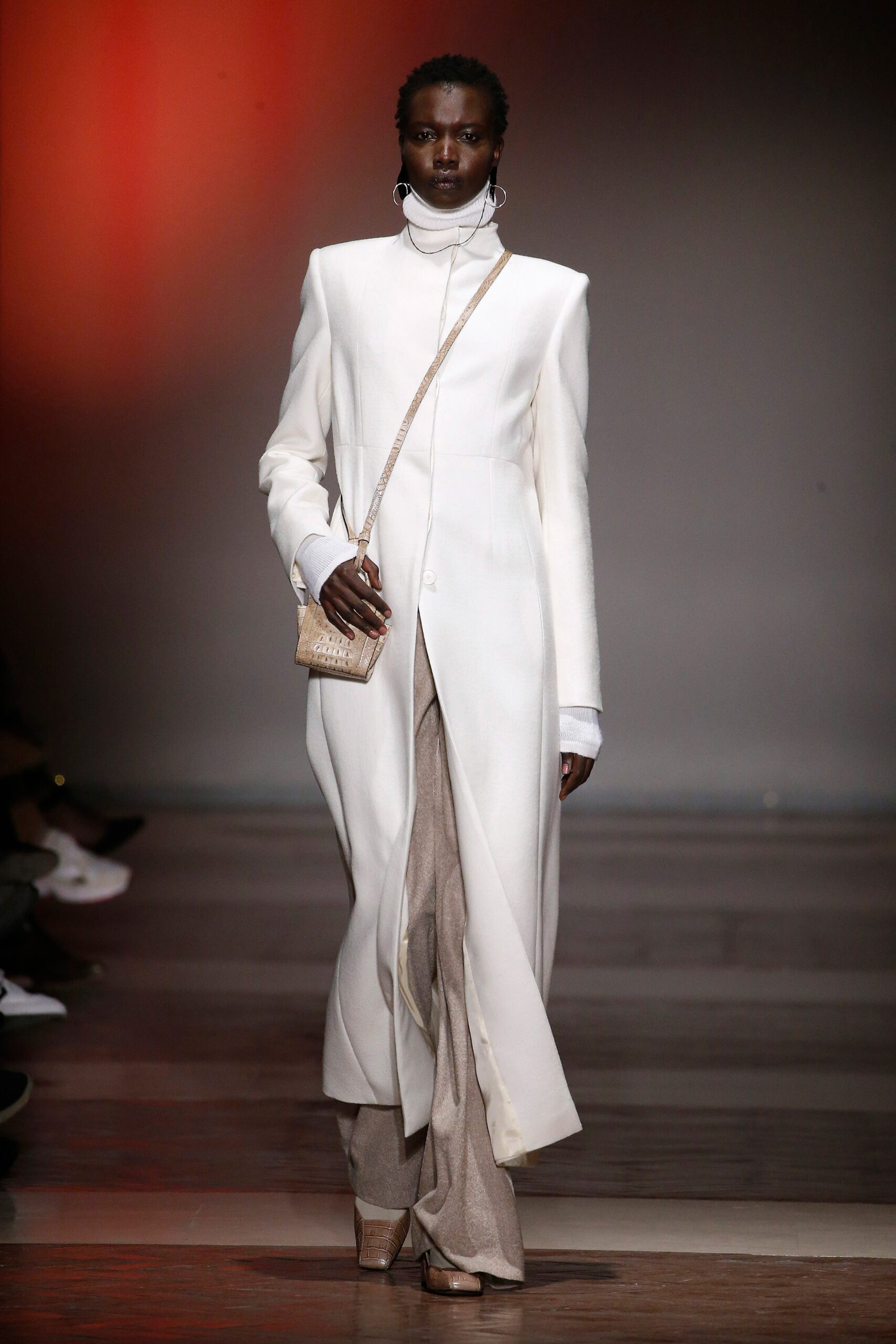 white wool fitted coat with beige pants