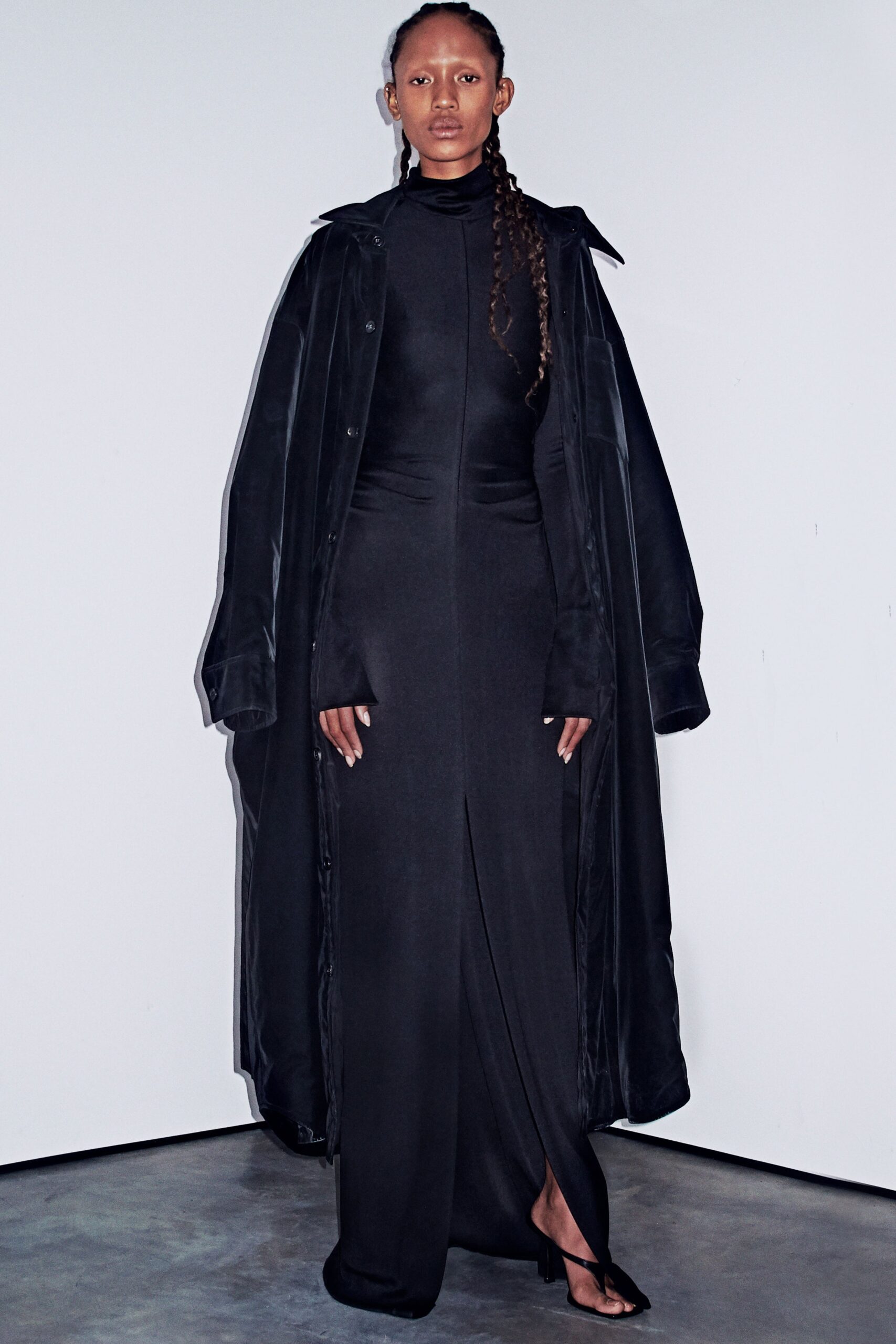 black silk dress with slit and oversized coat