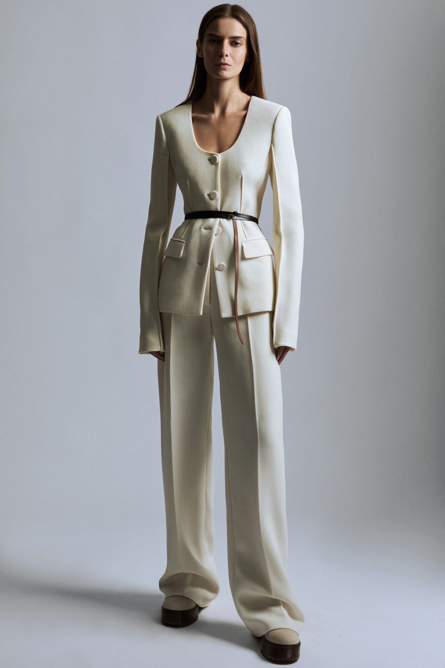 white wool long-sleeve v-neck tailored buttoned pockets suit
