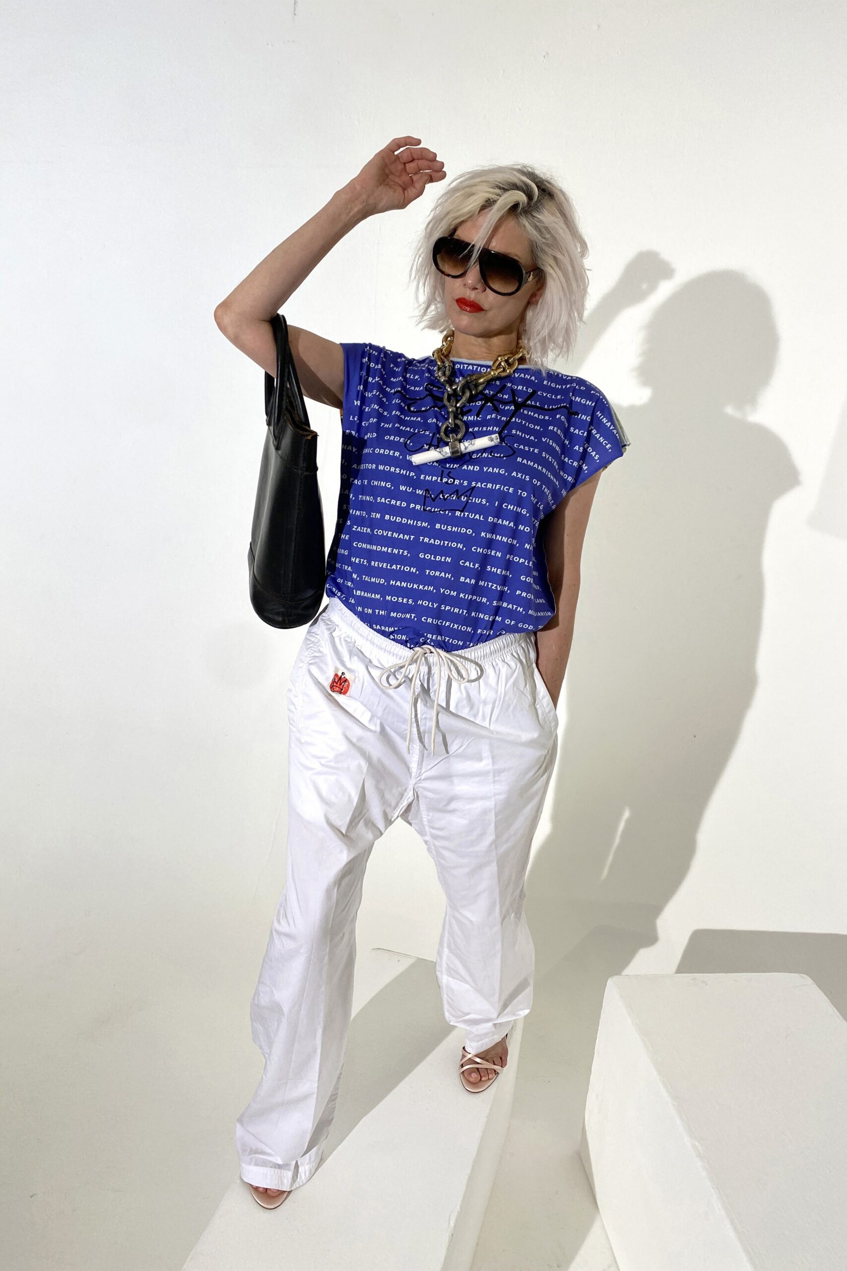 blue printed relaxed top with white pants
