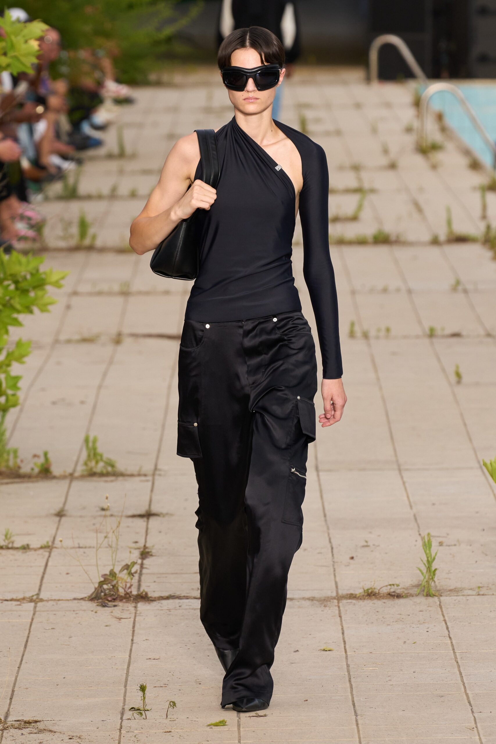 black asymmetric top and cargo pants