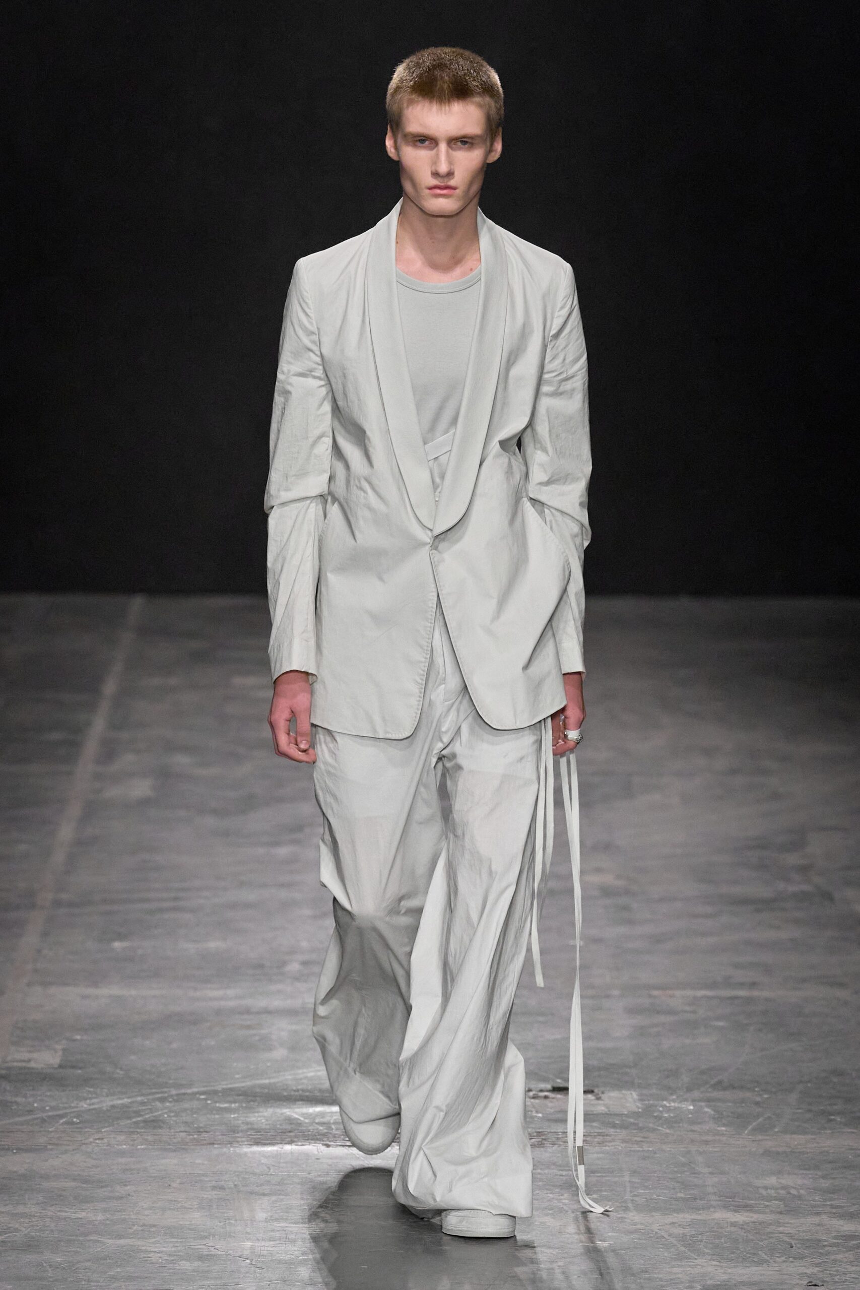 white relaxed suit with gray t-shirt