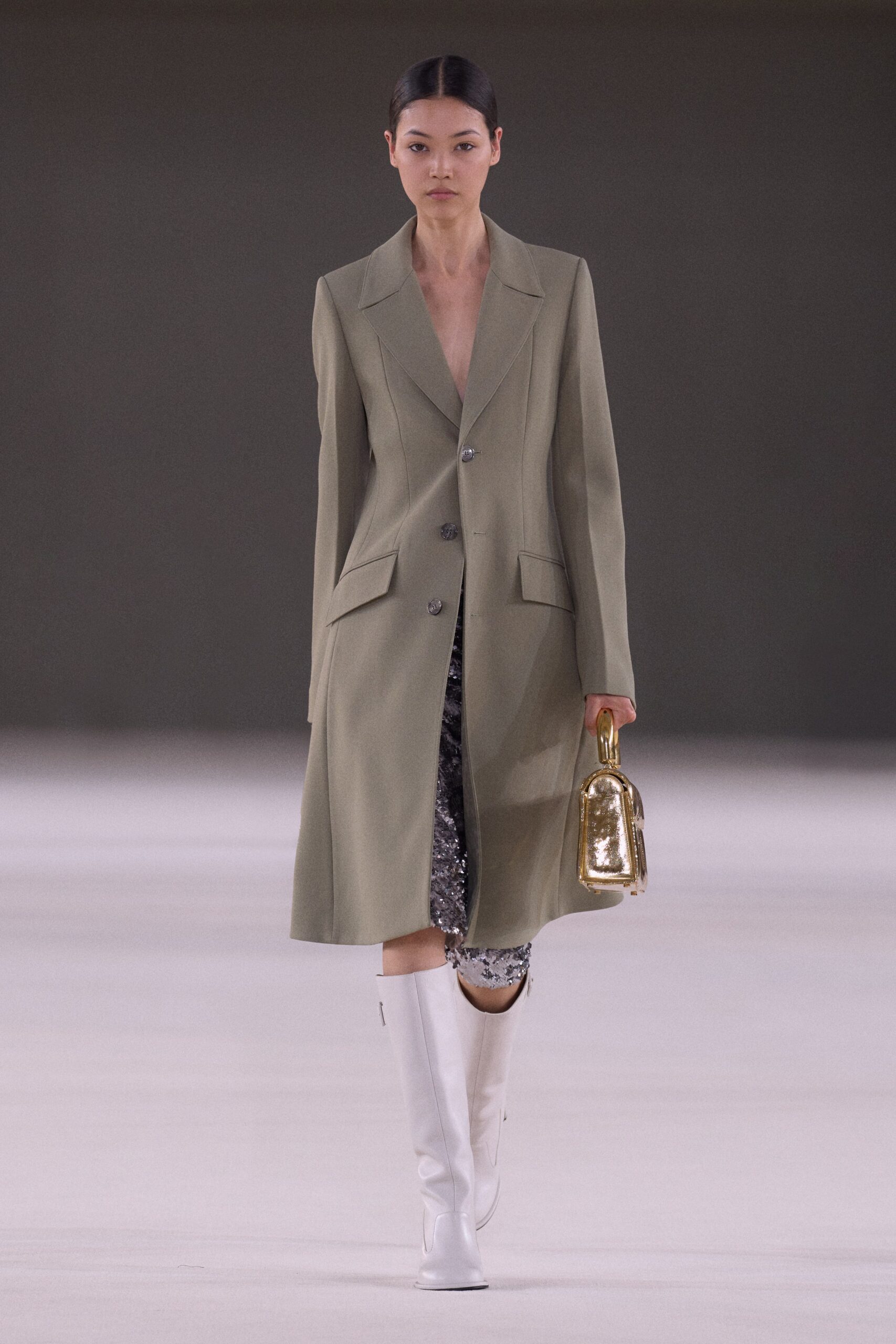 beige tailored coat with black pants