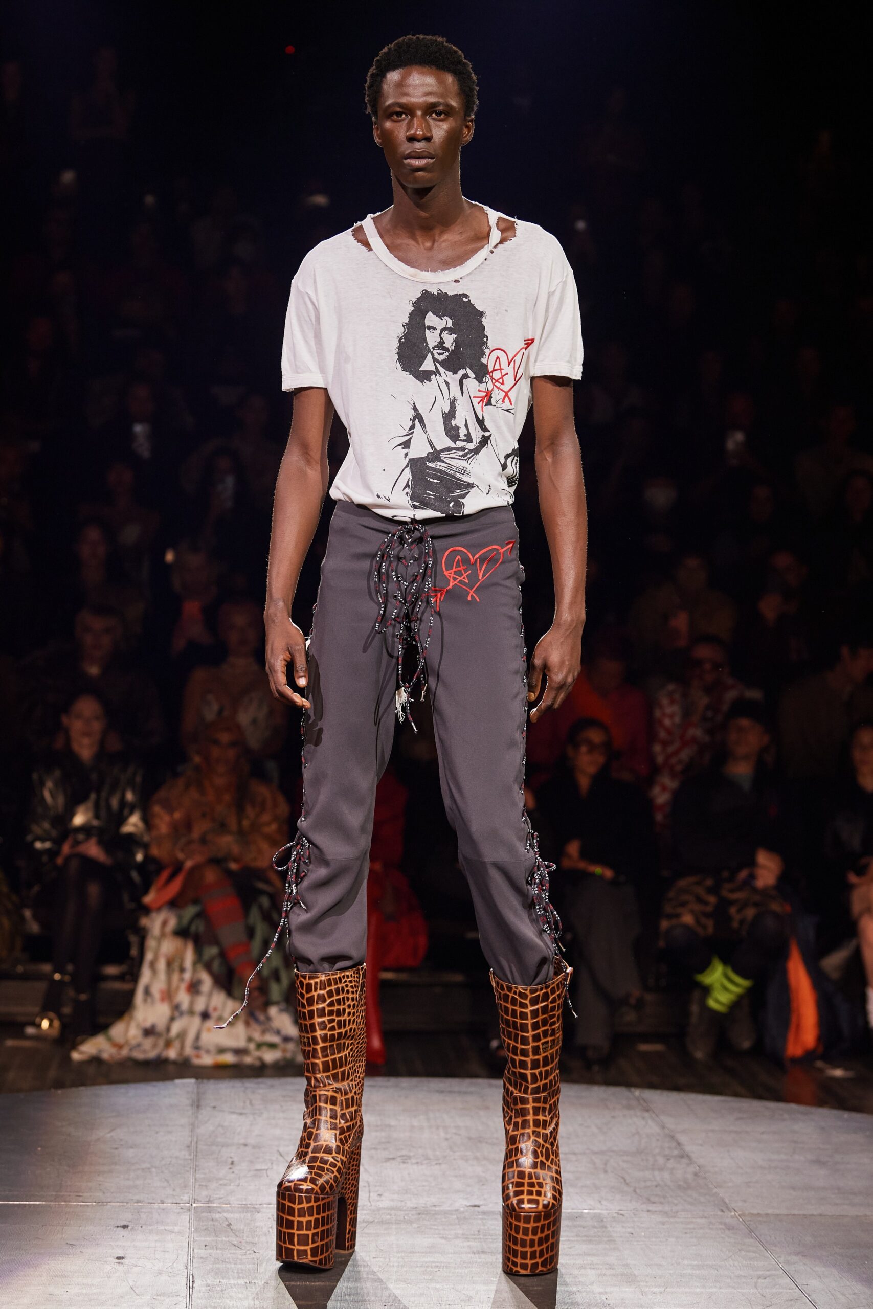 white printed t-shirt gray cargo pants brown high-heeled boots