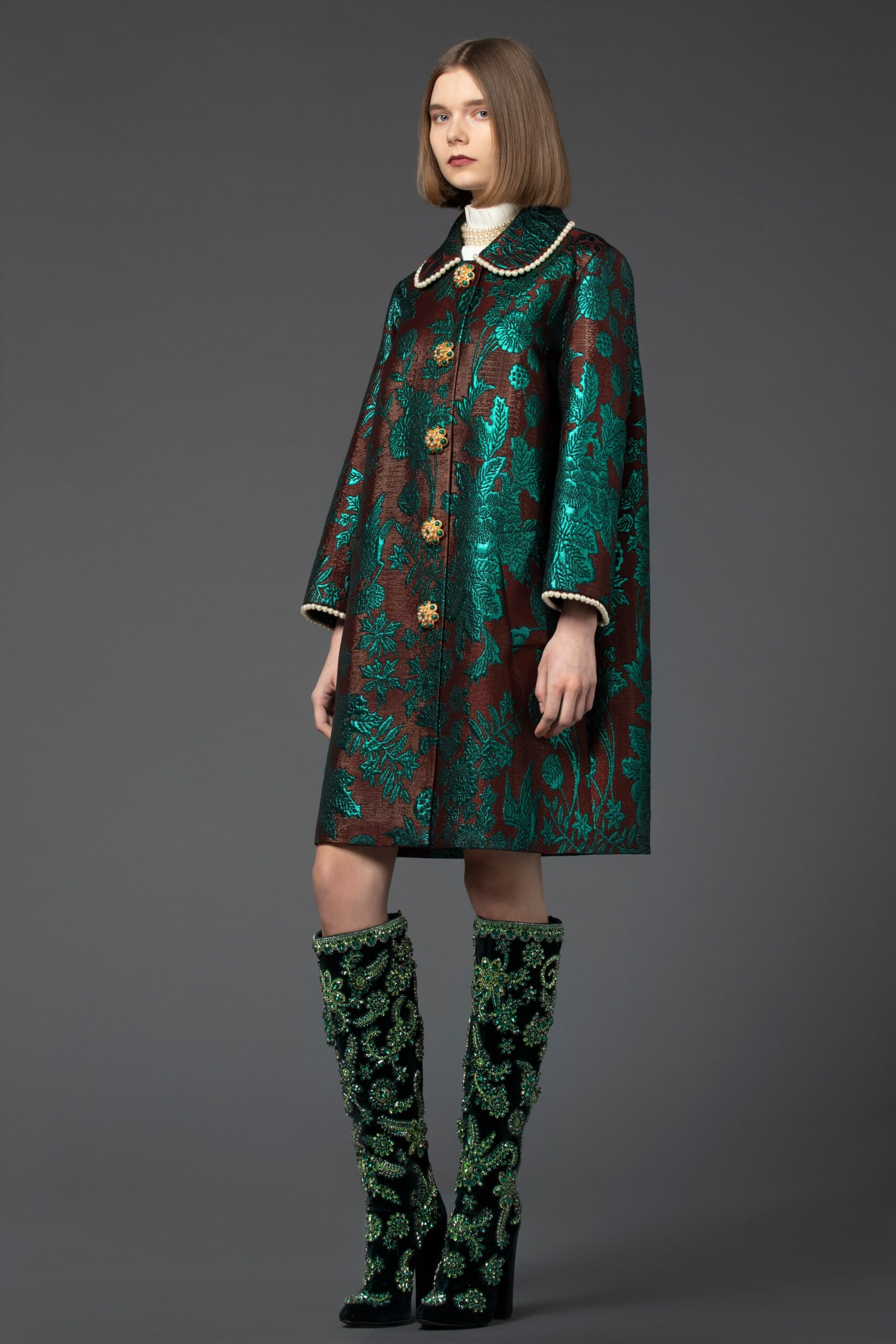 embroidered brown and green cape