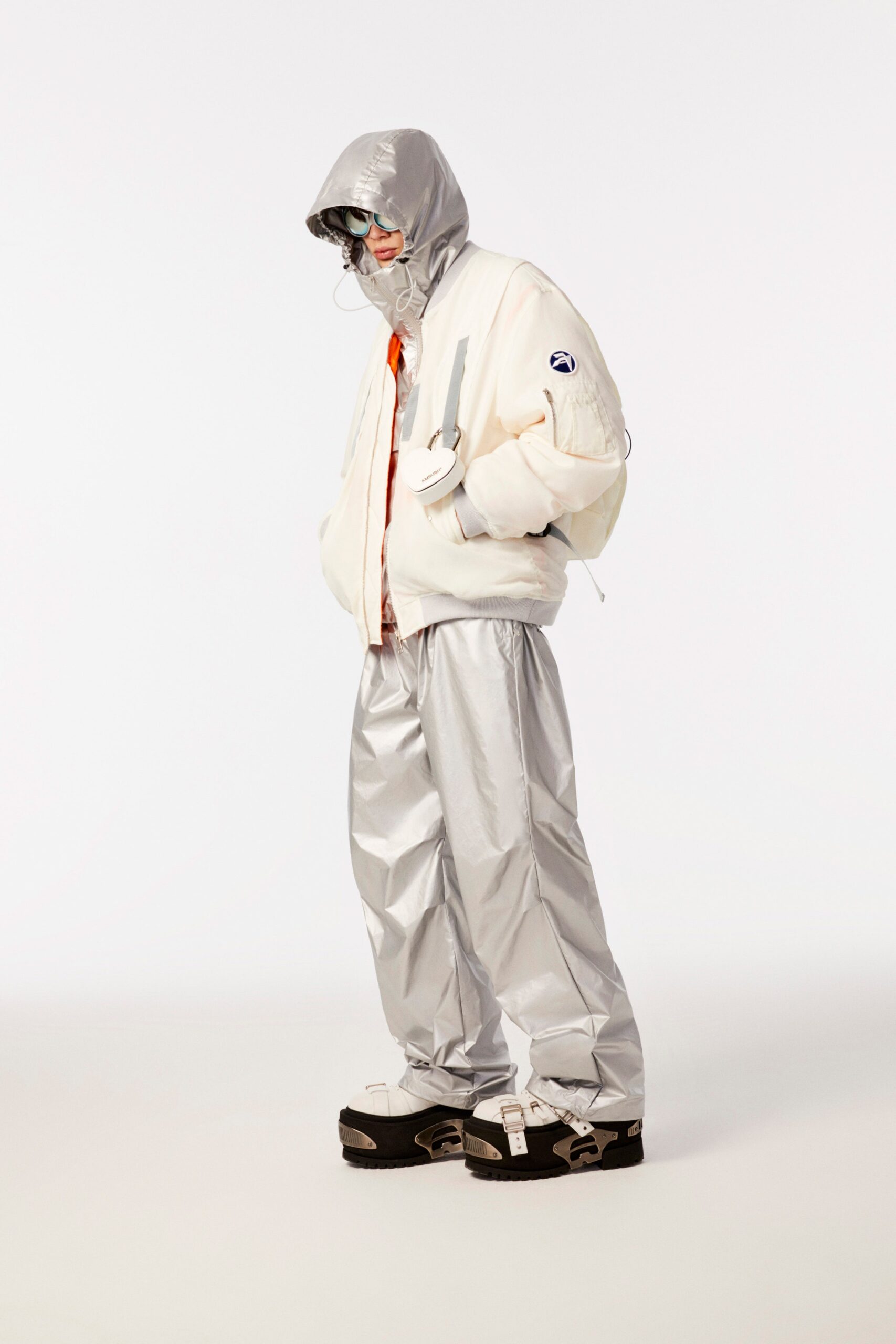 white vinyl hooded jacket with silver pants