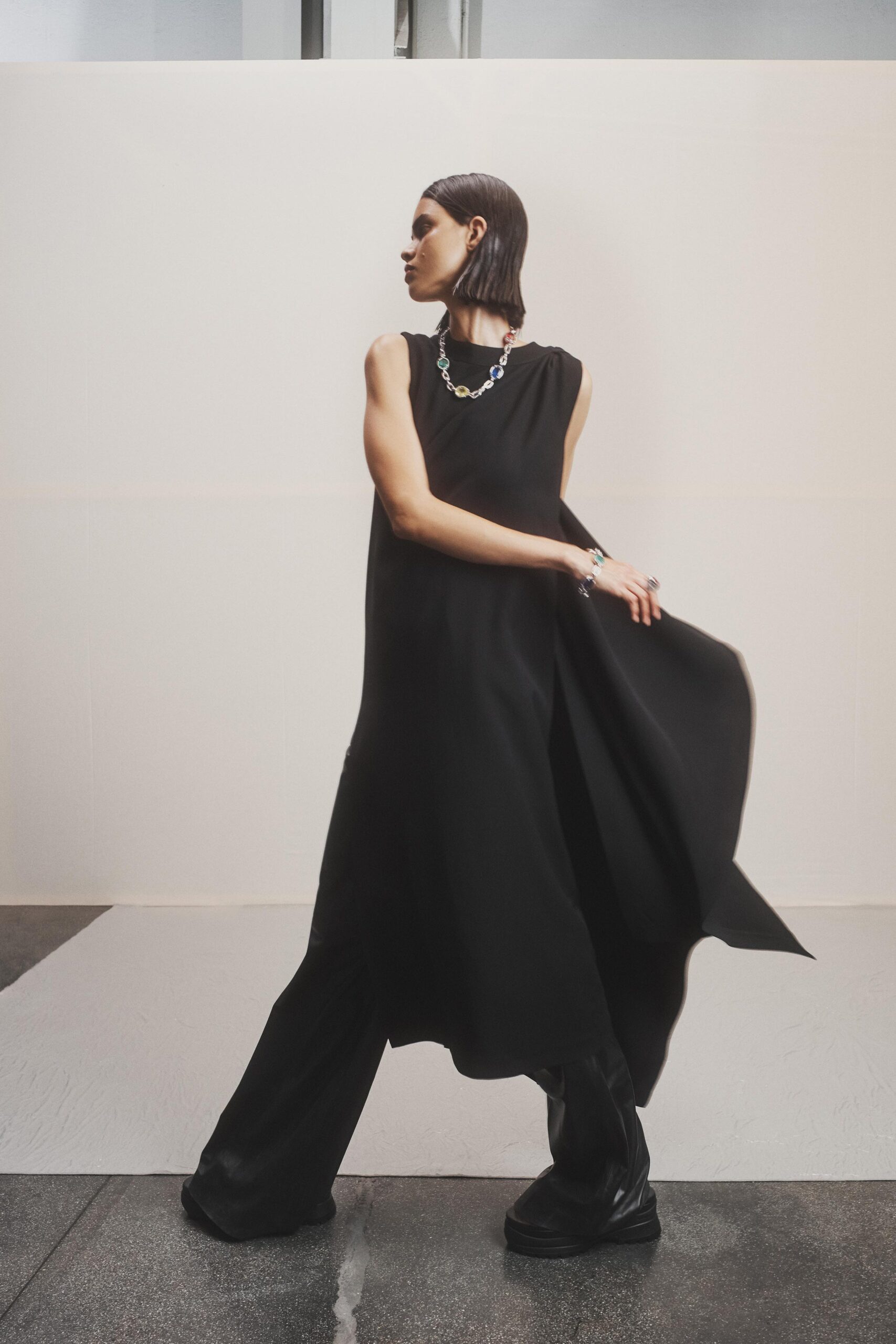 black silk midi dress and relaxed pants