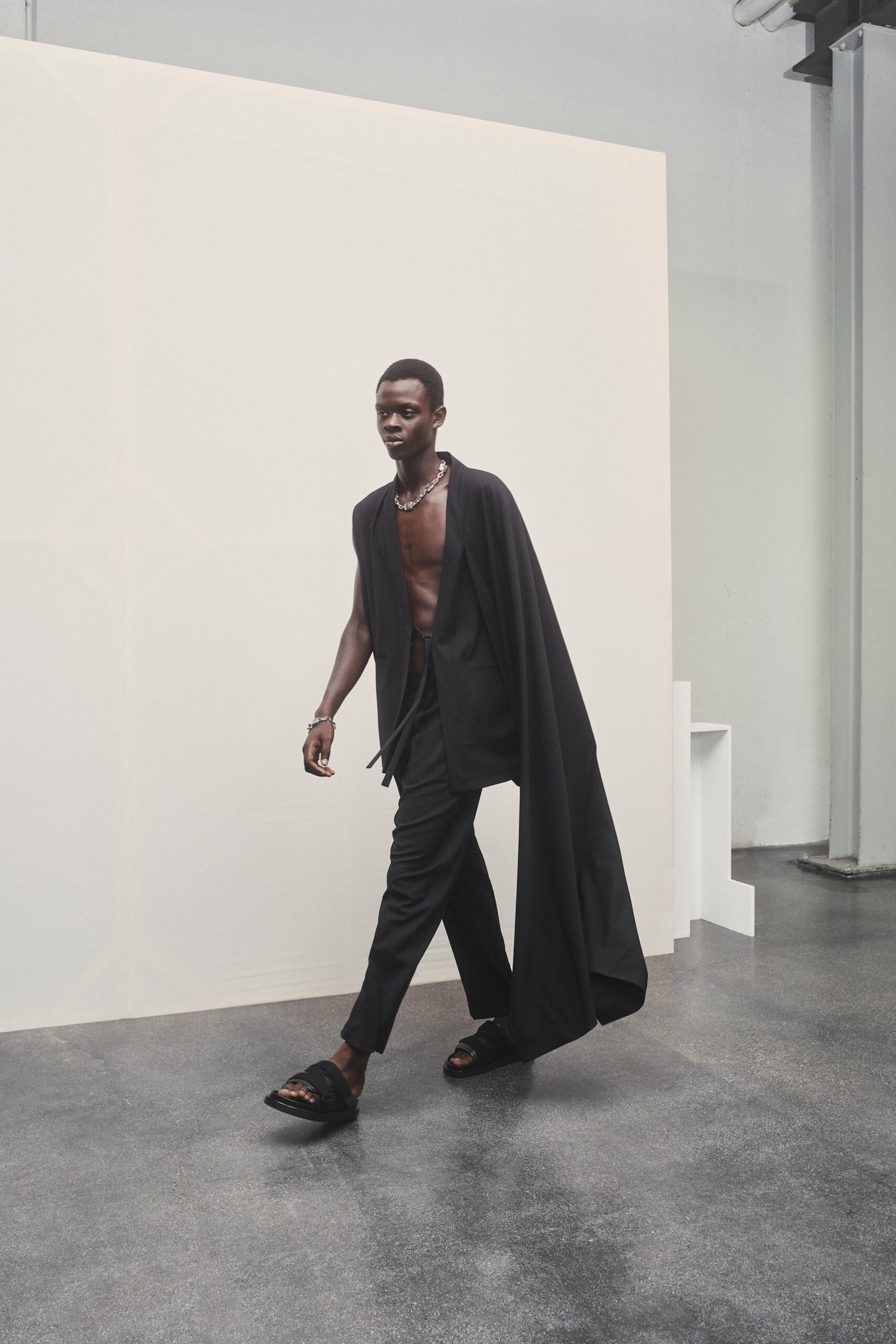 black fitted pants and cape