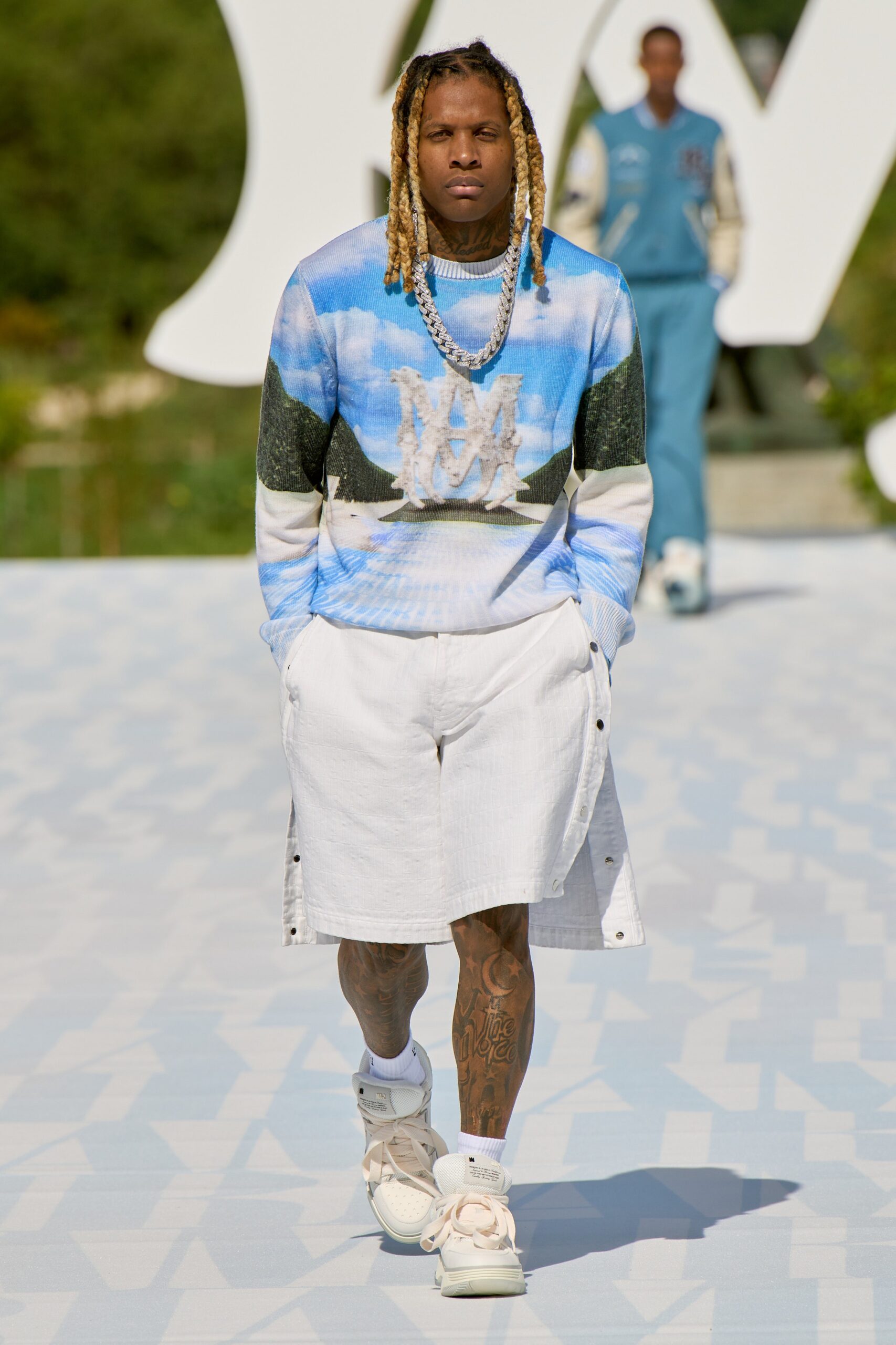blue printed sweater with white shorts