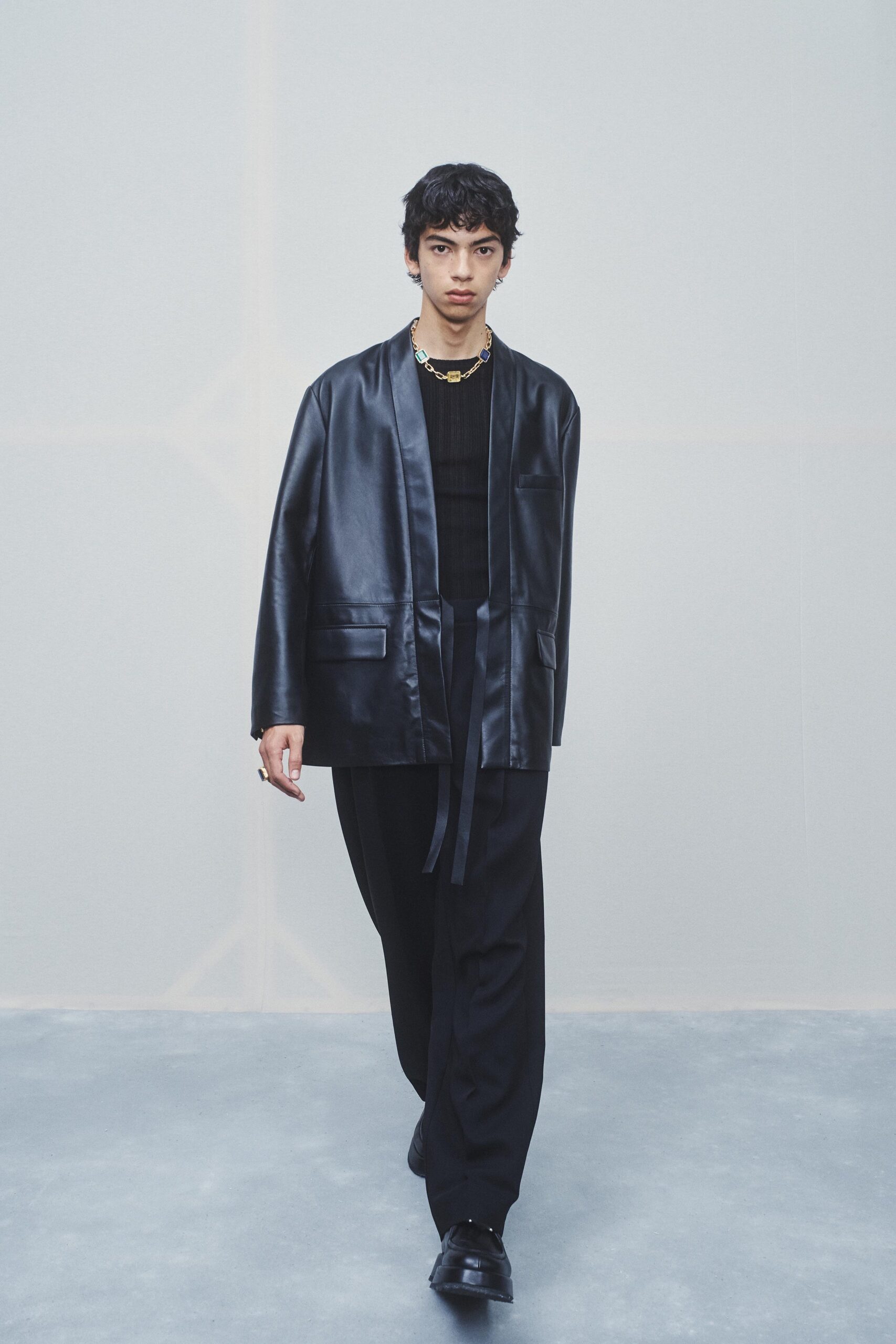 black leather jacket and tailored pants
