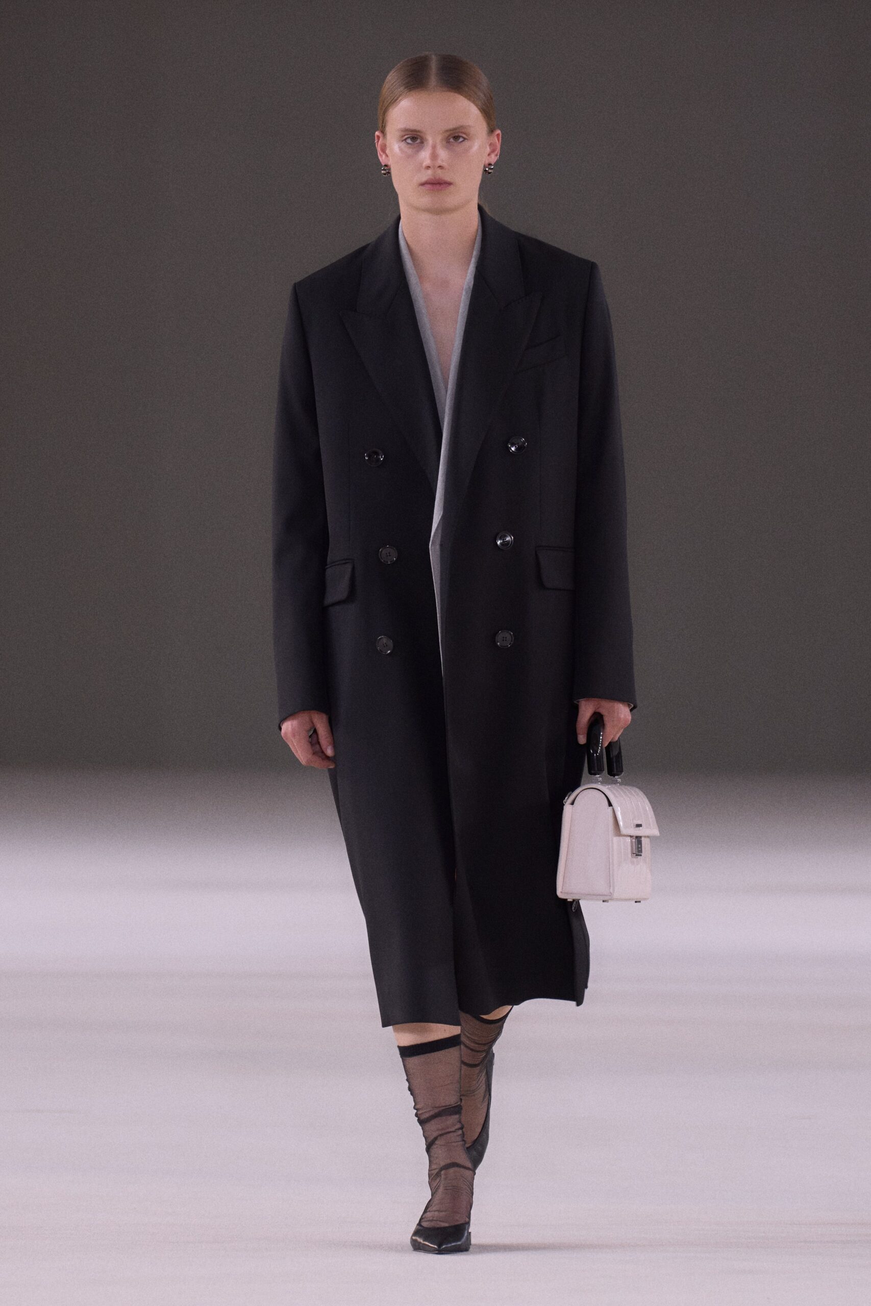 black wool long-sleeve collared oversized structured midi coat